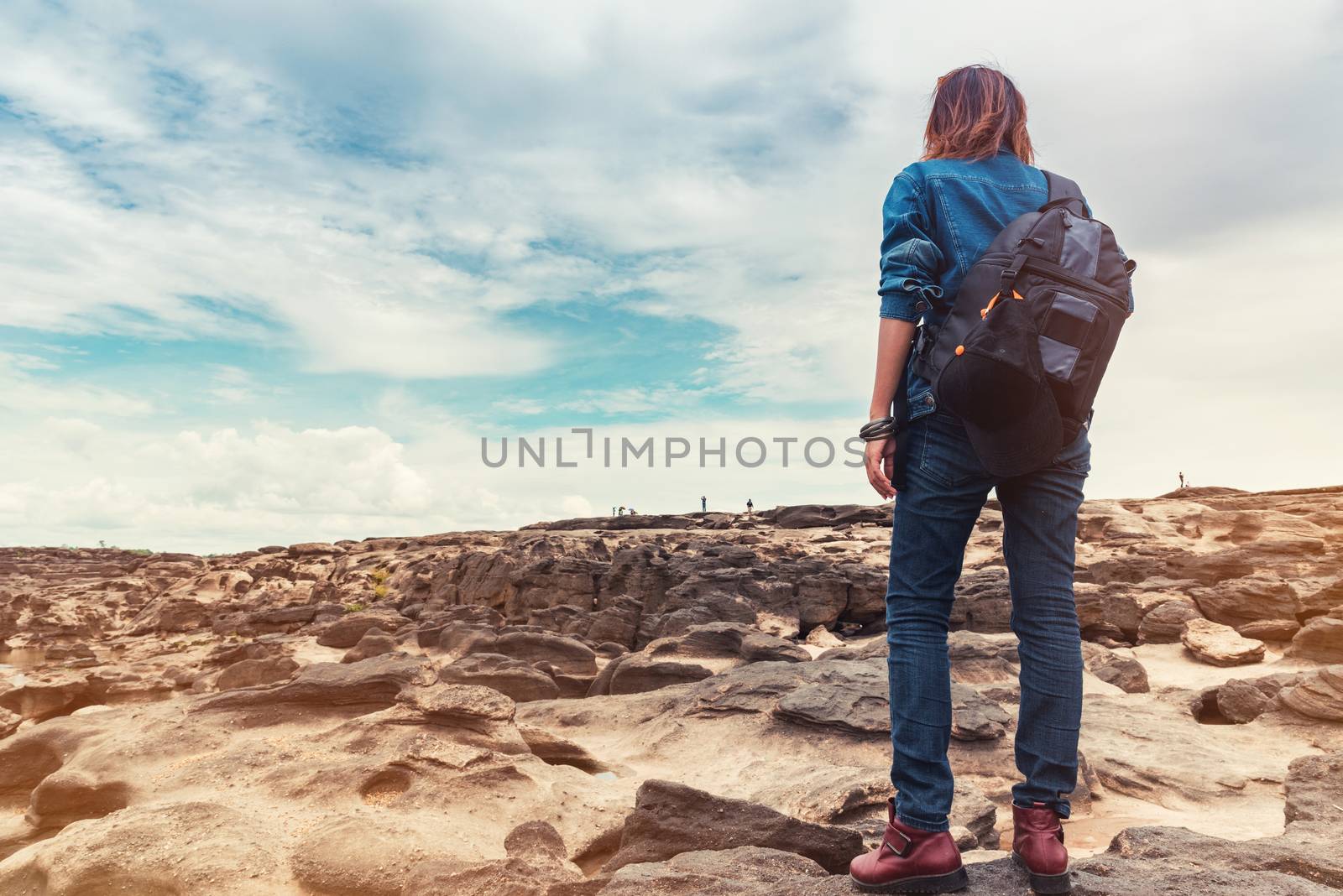 Asian woman enjoying the climbing natural stone,Focus on Women.