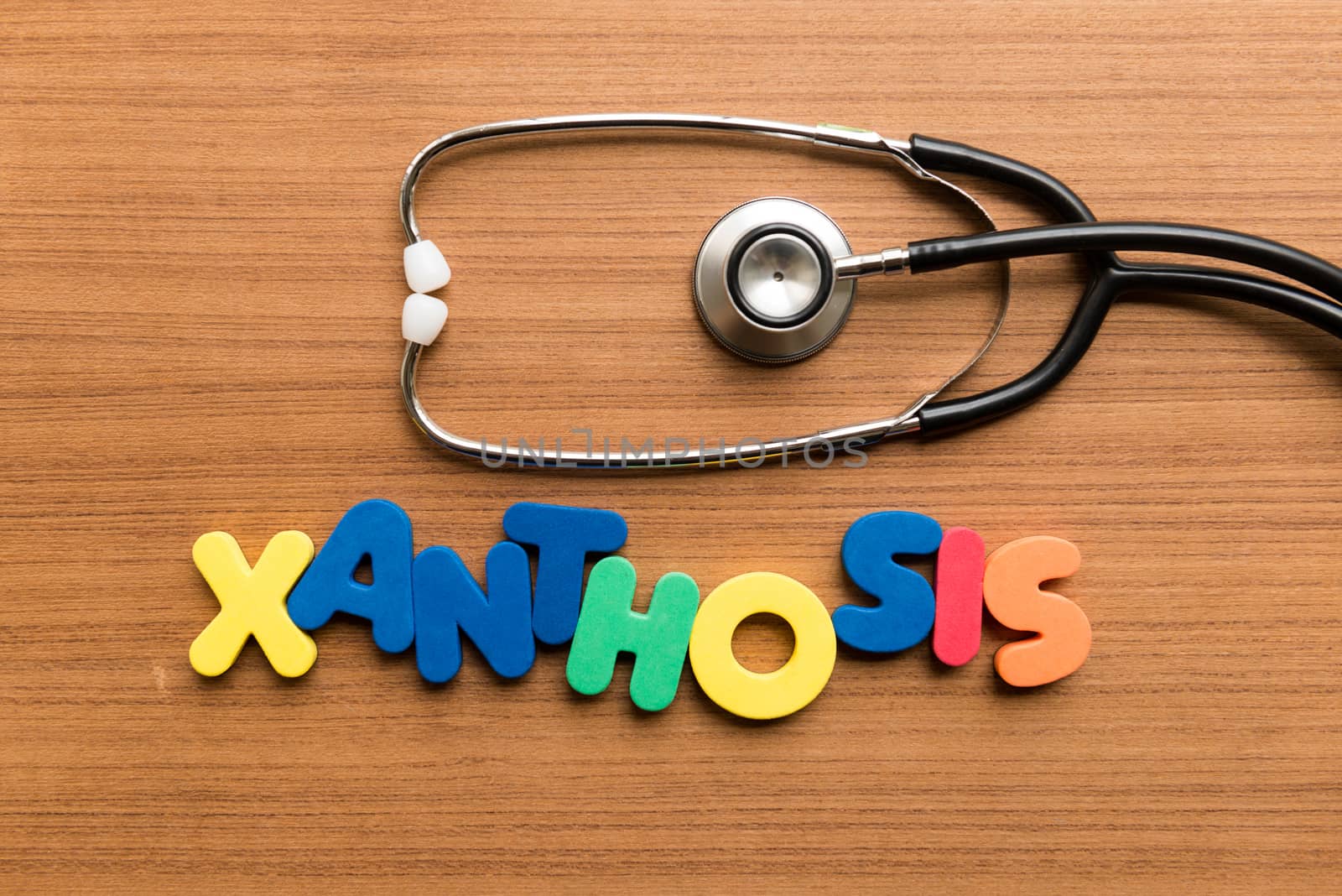 xanthosis colorful word with stethoscope on wooden background