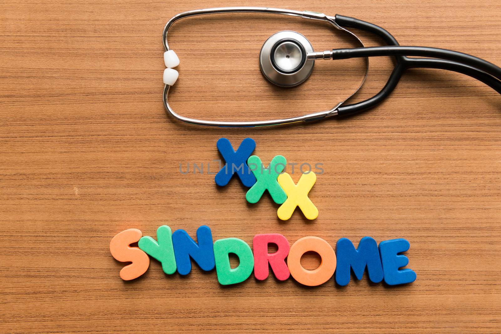 xxx syndrome colorful word with stethoscope on wooden background
