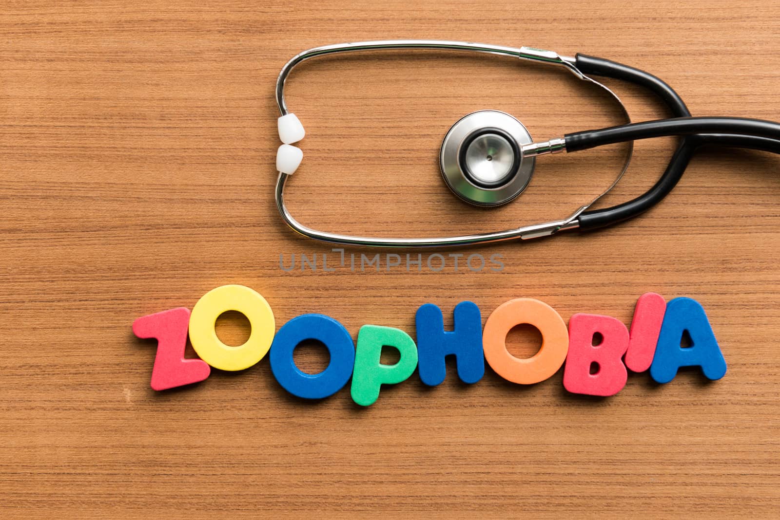 zoophobia colorful word with stethoscope on wooden background