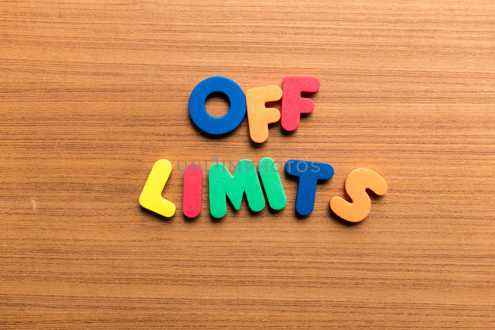 off limits colorful word on the wooden background