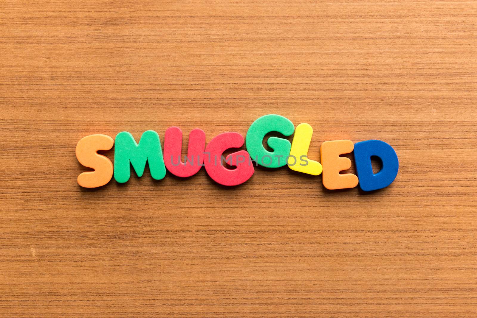 smuggled colorful word on the wooden background