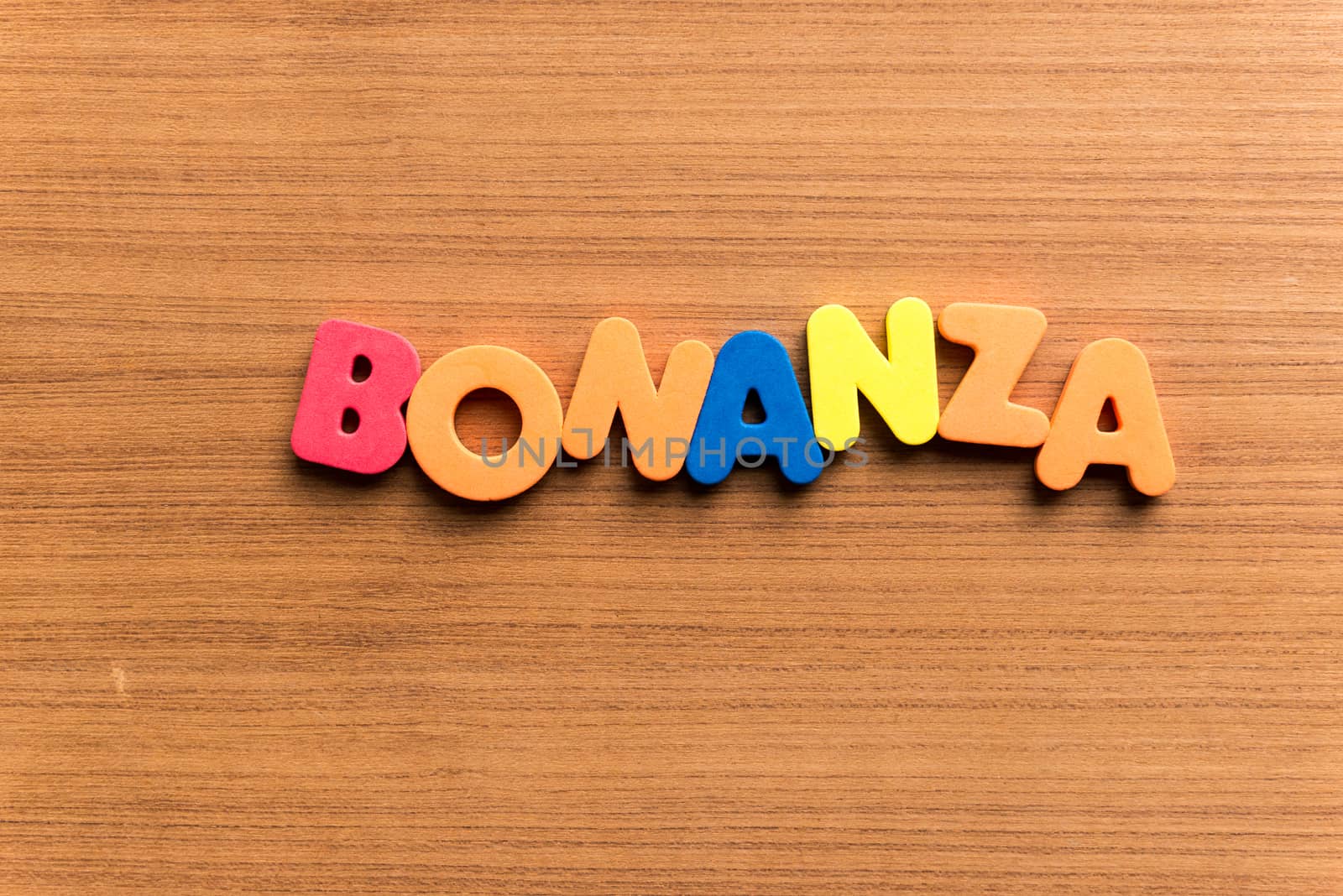 bonanza colorful word on the wooden background