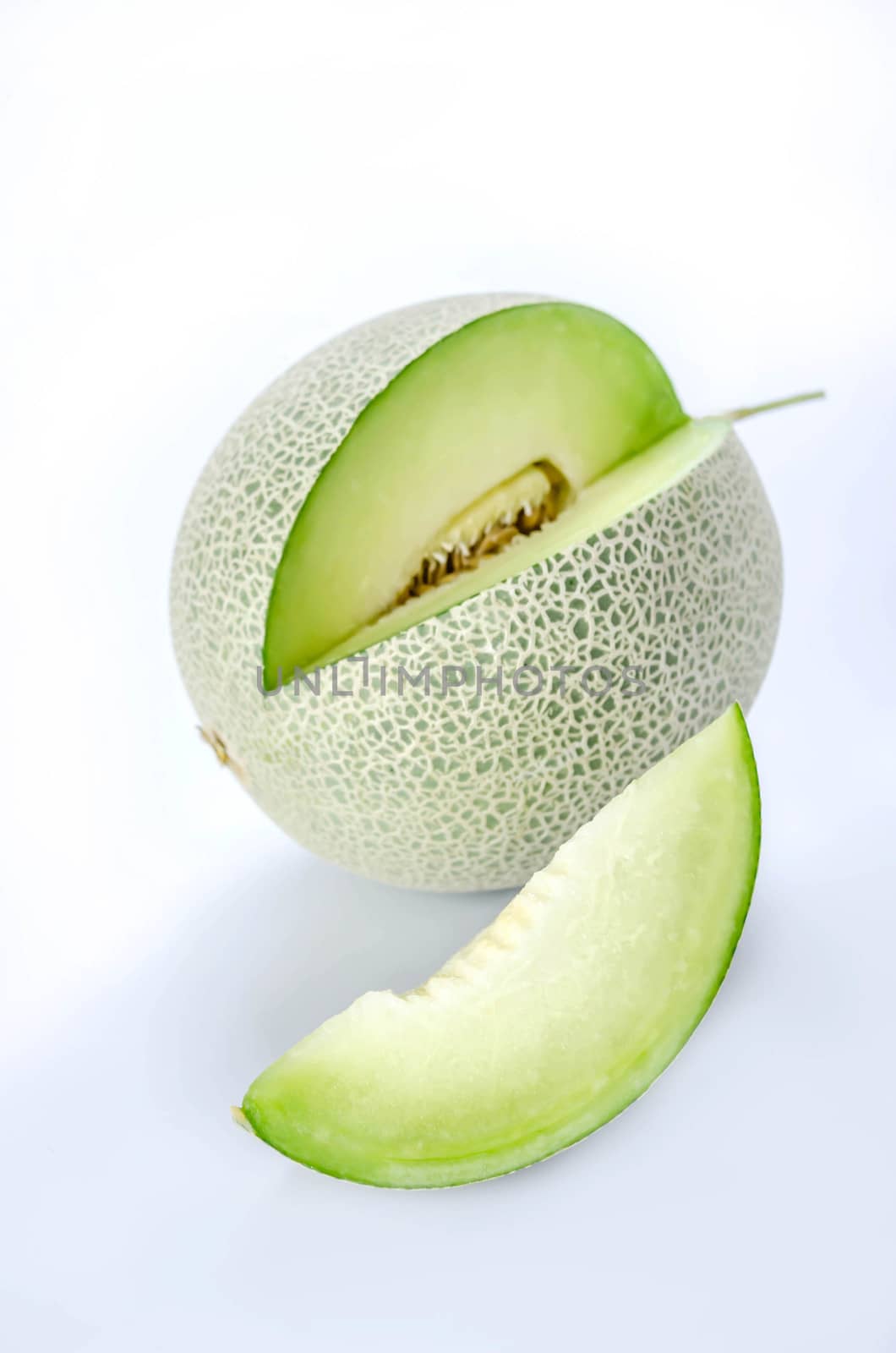 shopped green melon isolated on white background