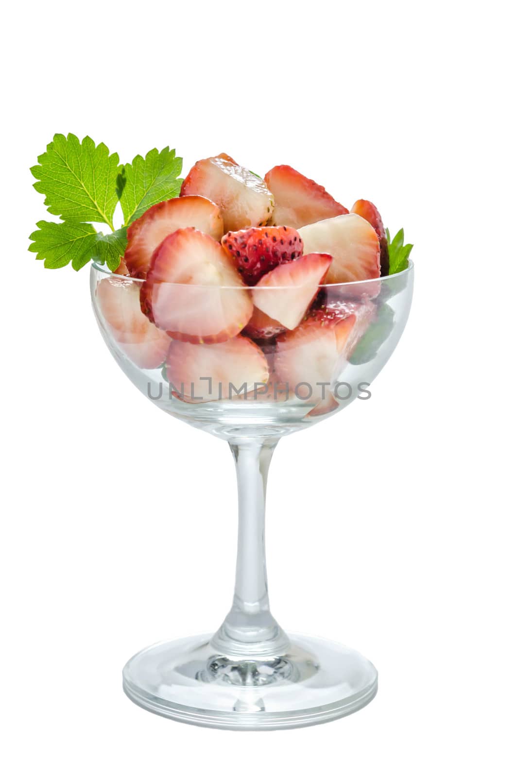 Fresh slices of strawberry in glass on a white background isolated