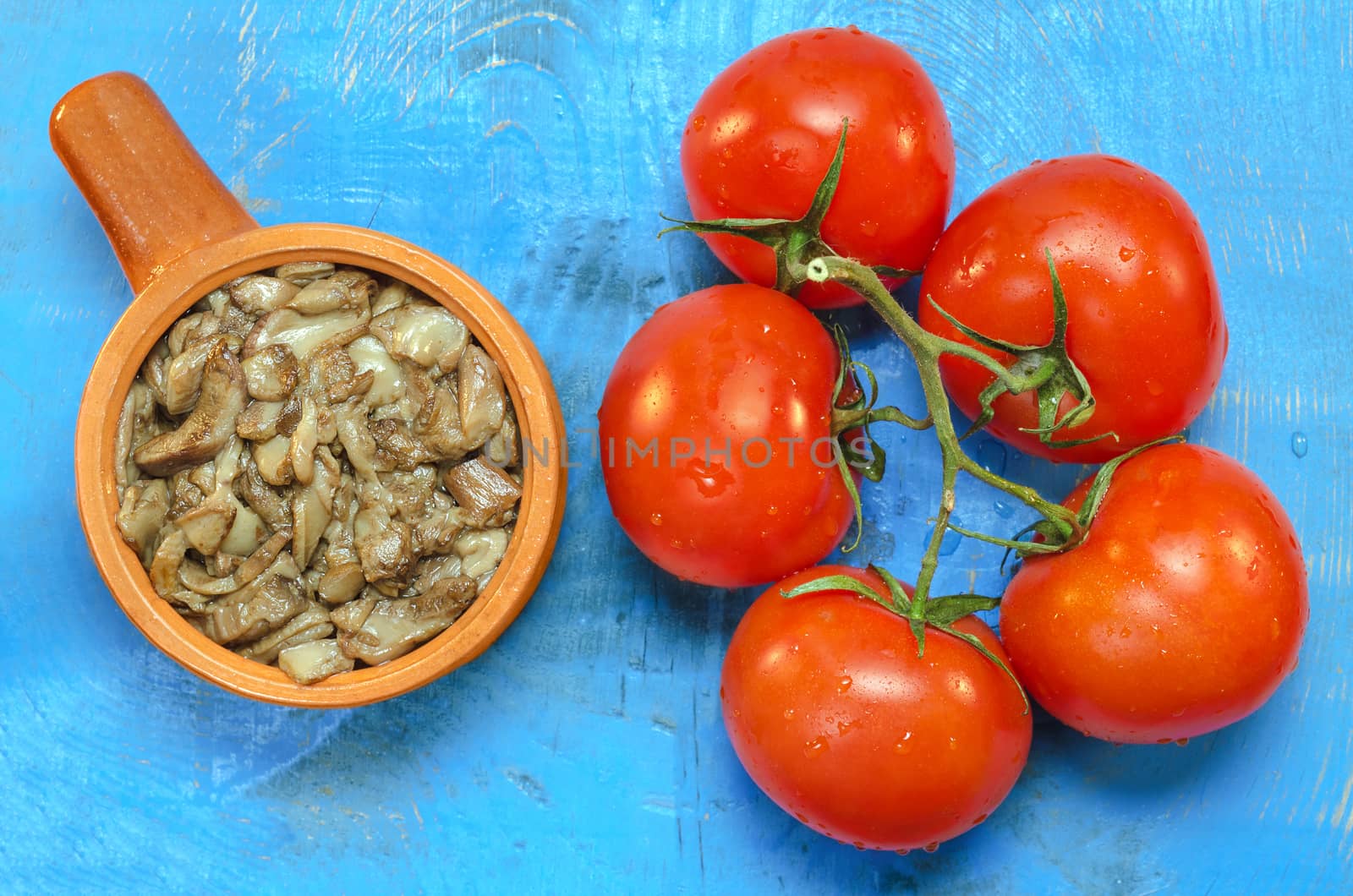 Fried mushrooms and fresh tomatoes on the branch by Gaina