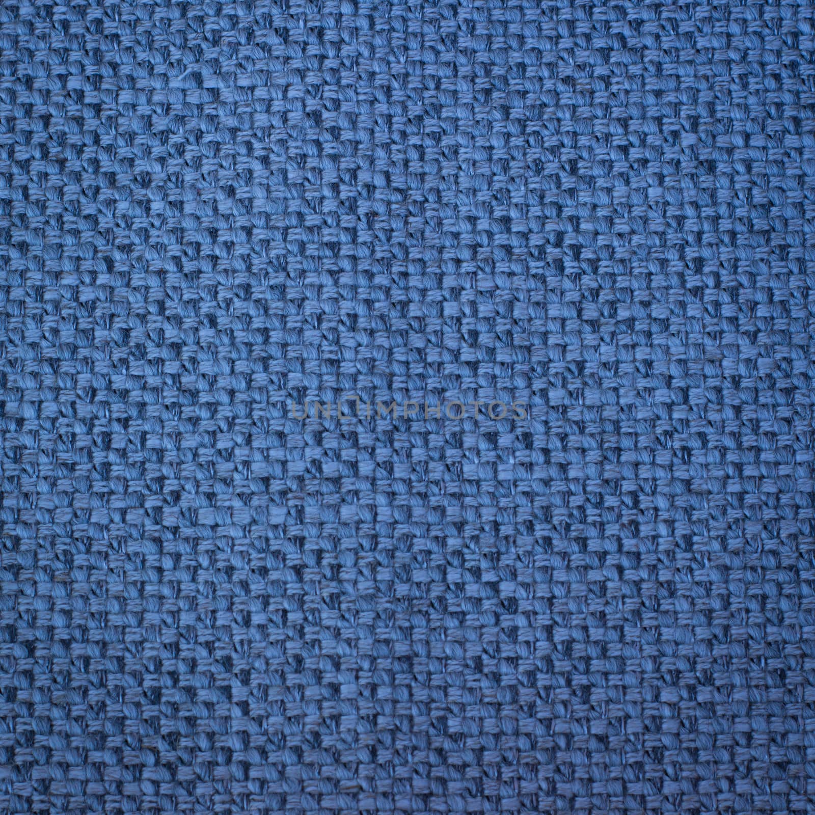 Rustic canvas fabric texture in blue color.