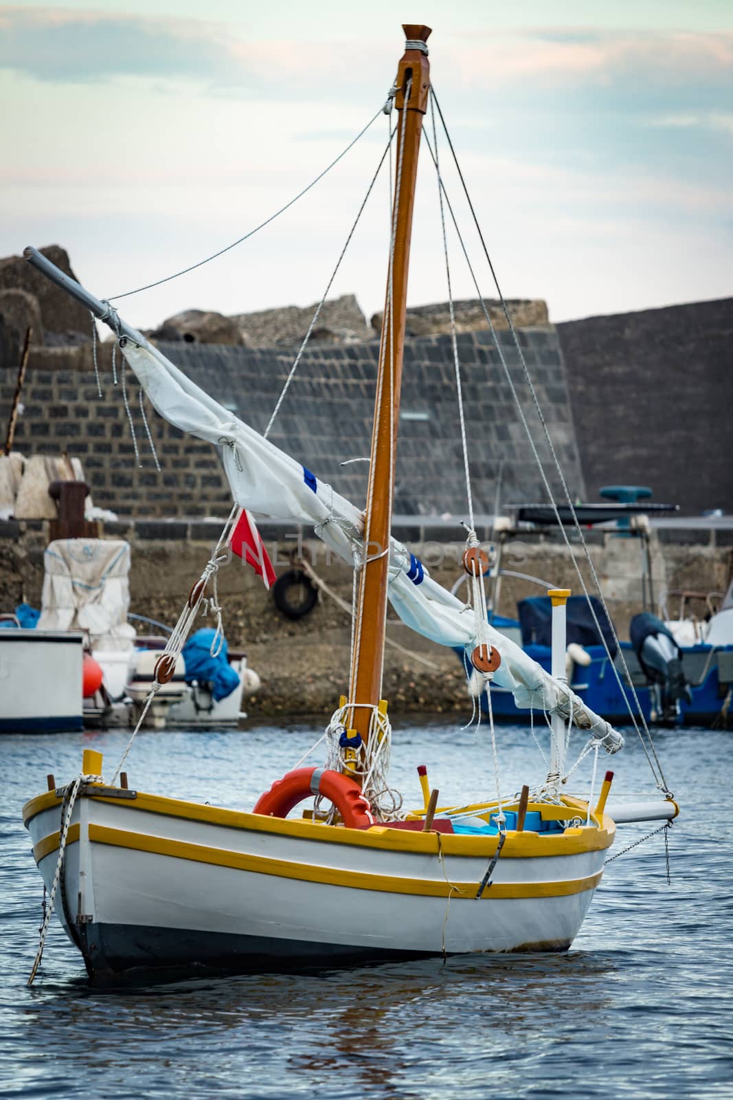 Sicily - Italy. The sailboat anchored in the harbor.