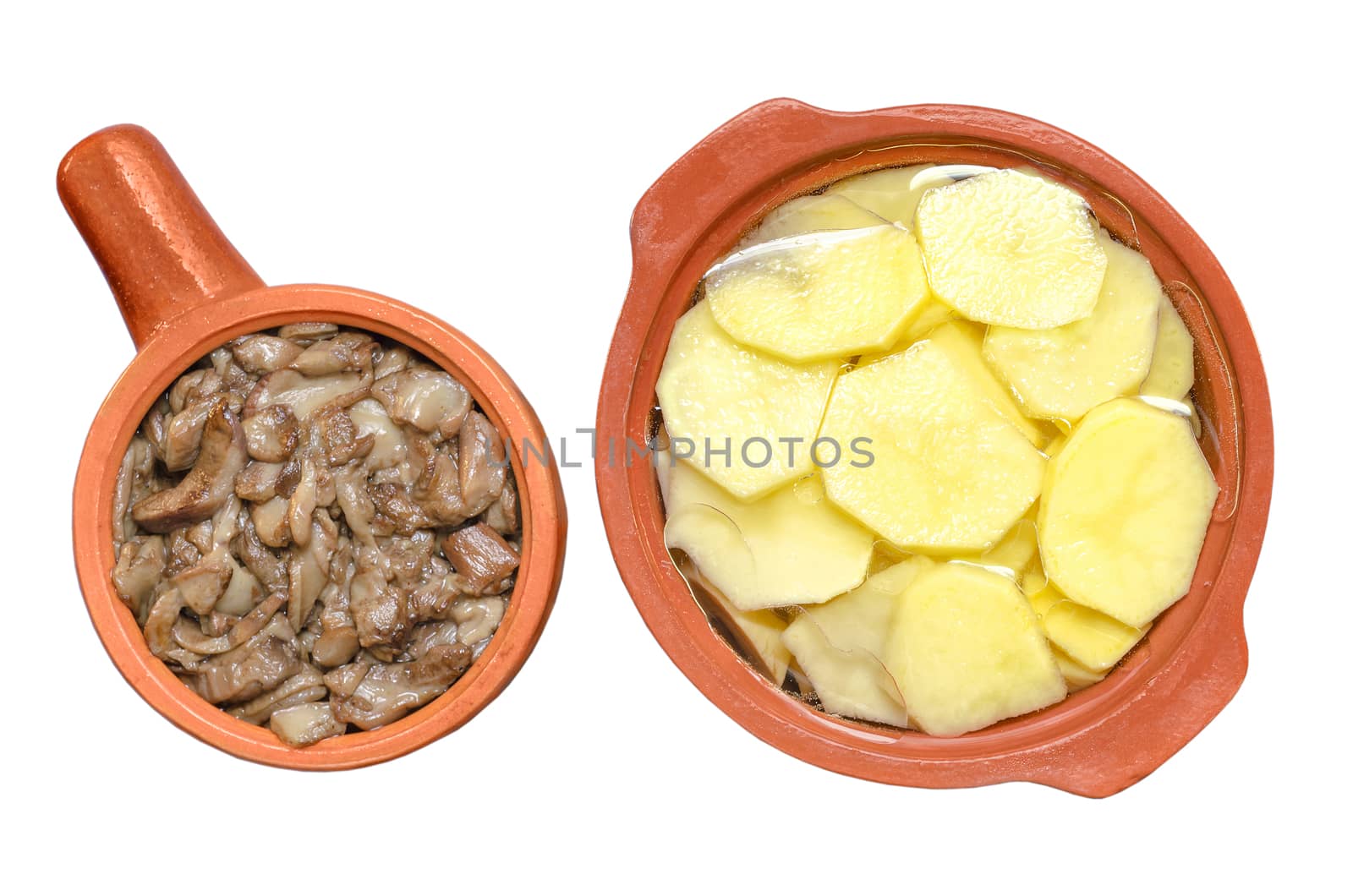 Sauteed mushrooms and raw sliced potatoes isolated on white background by Gaina