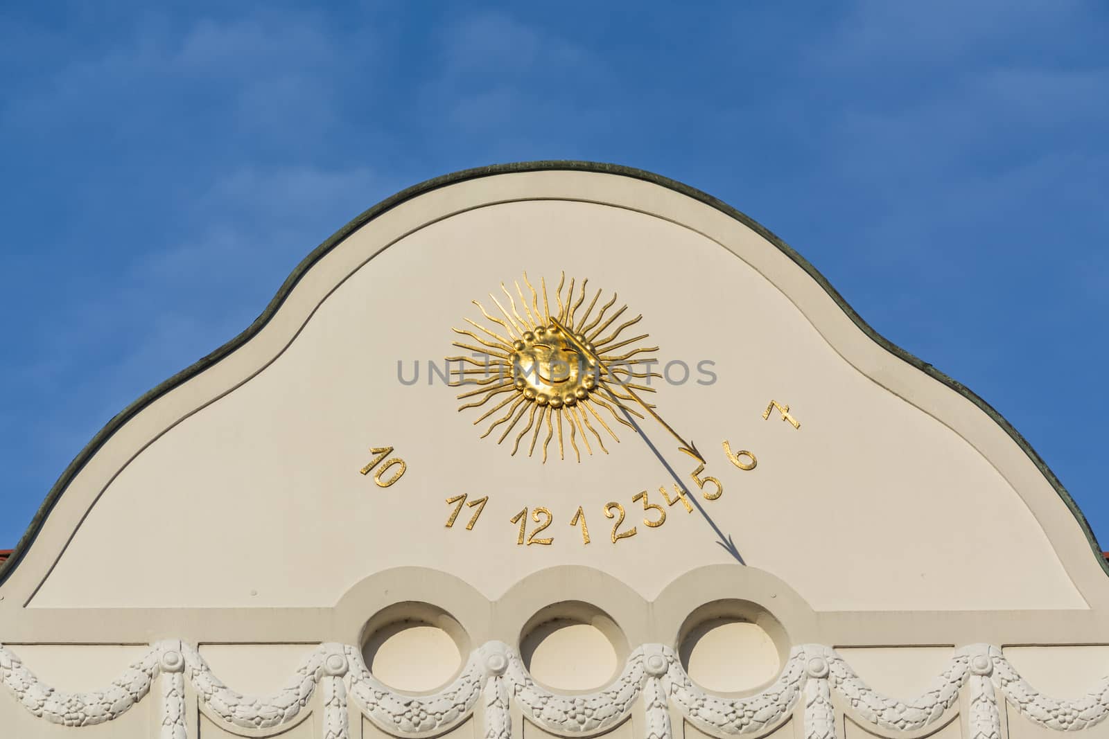  Sundial clock on a house facade by JFsPic