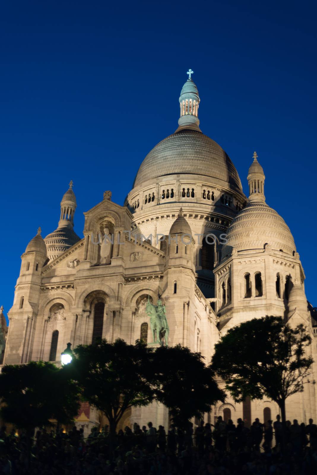 Sacre Coeur at dusk with people in Silhouette