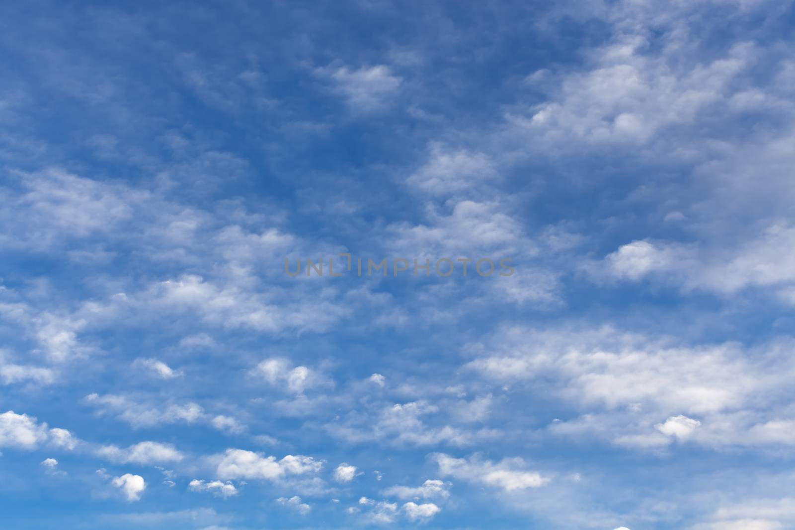 The beautiful blue sky with white clouds by fotooxotnik