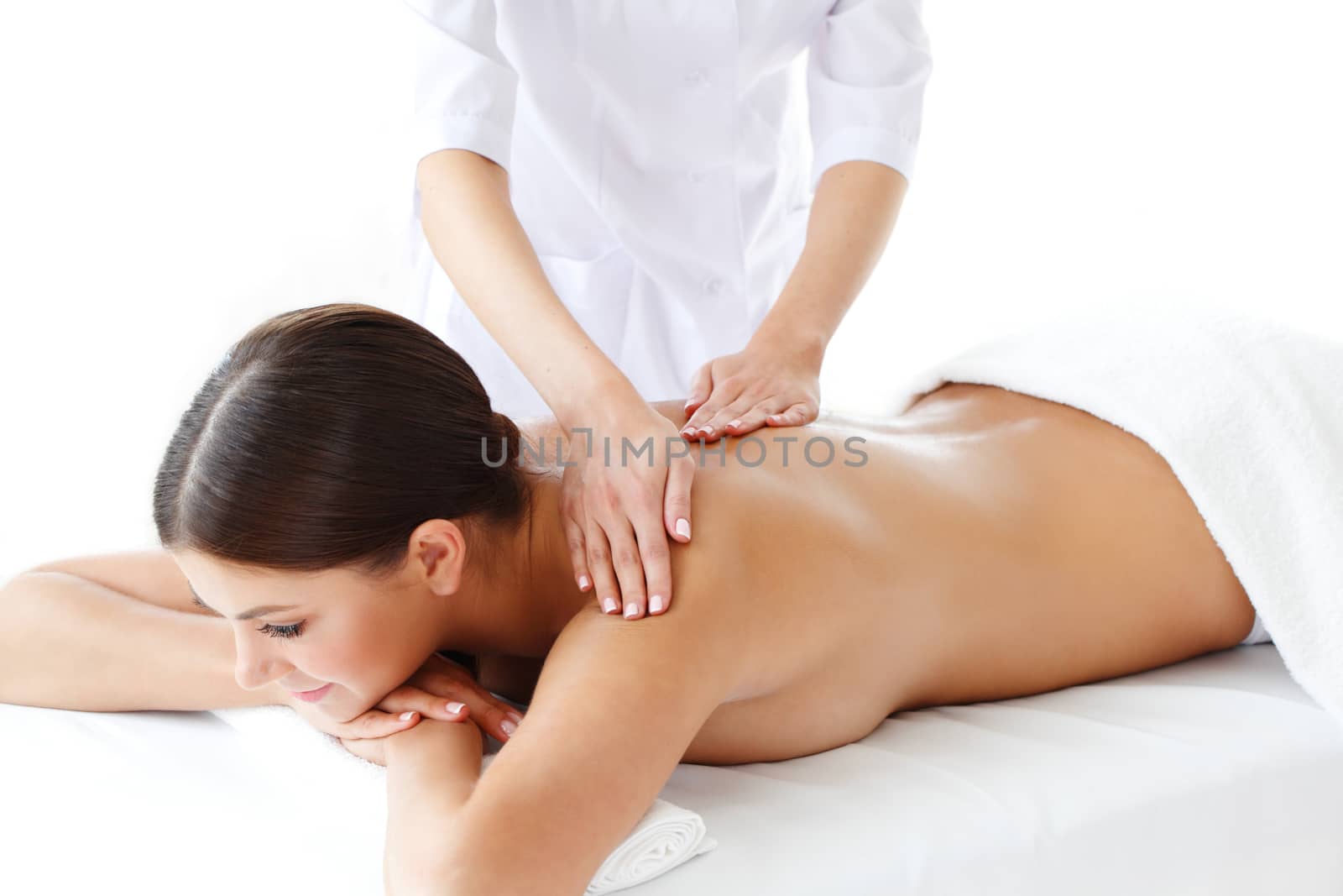 Woman getting massage by ALotOfPeople