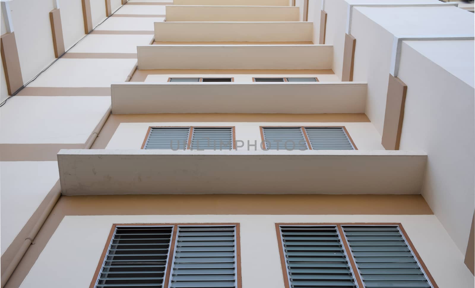 Look up at apartment housing in Thailand. Step of building.