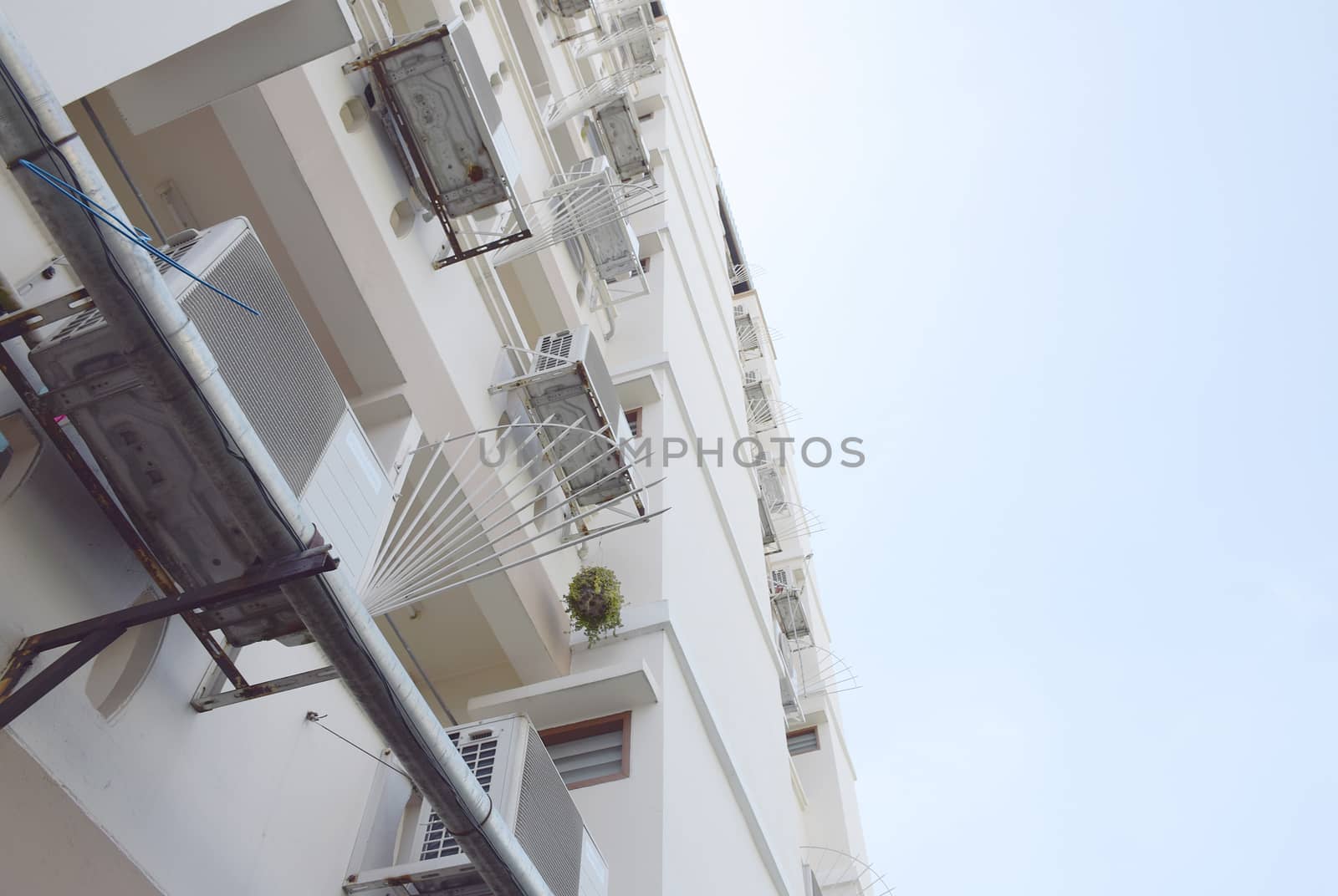 Look up at apartment housing in Thailand. Step of building.