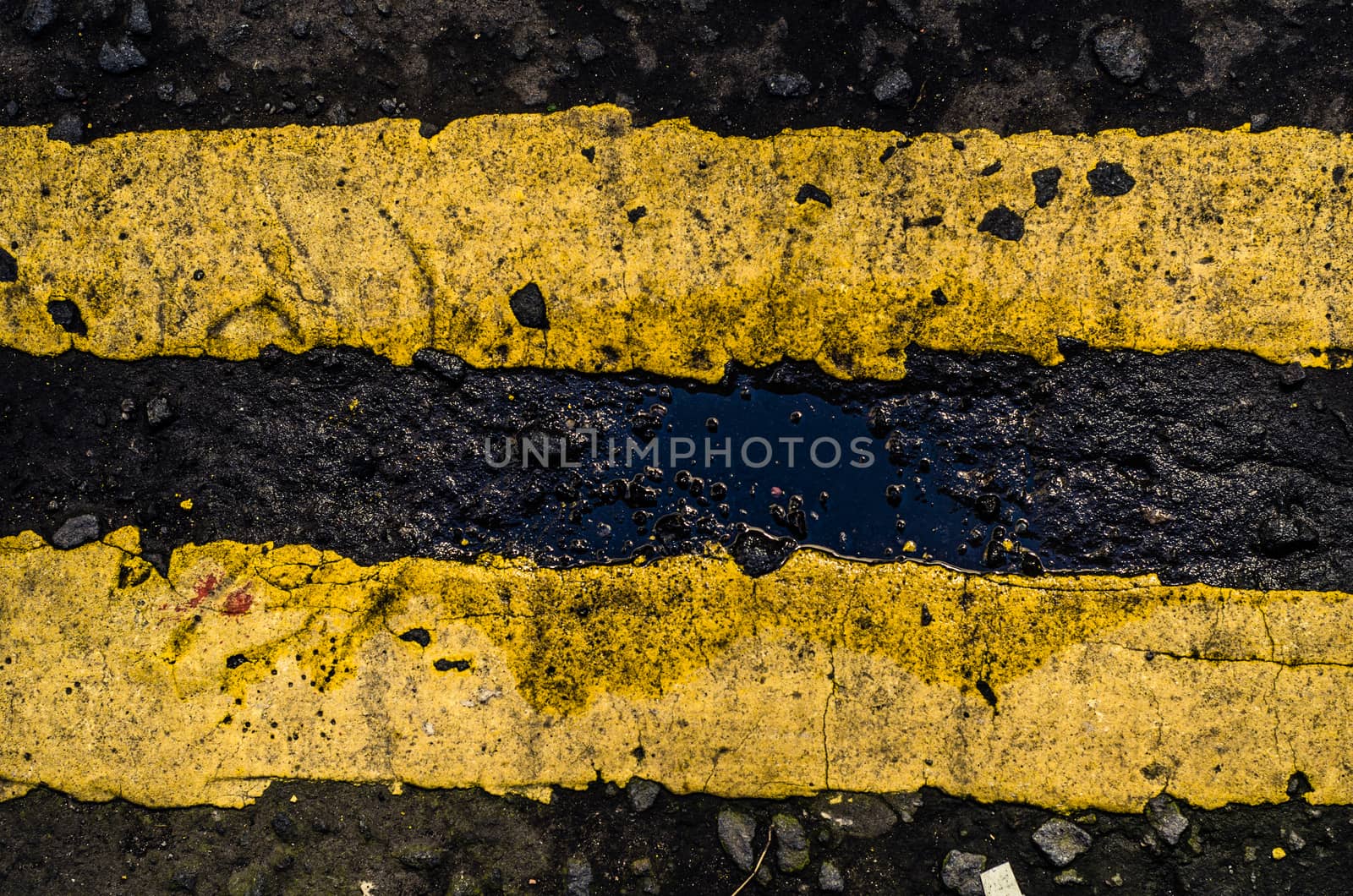 Grungy Double Yellow Line Road Markings On A British Street