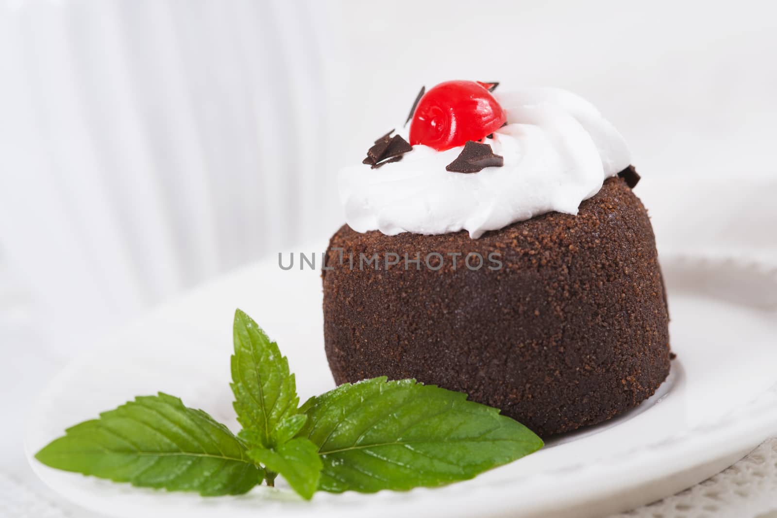 Chocolate sweet cake "Potato" on a plate, selective focus by kzen