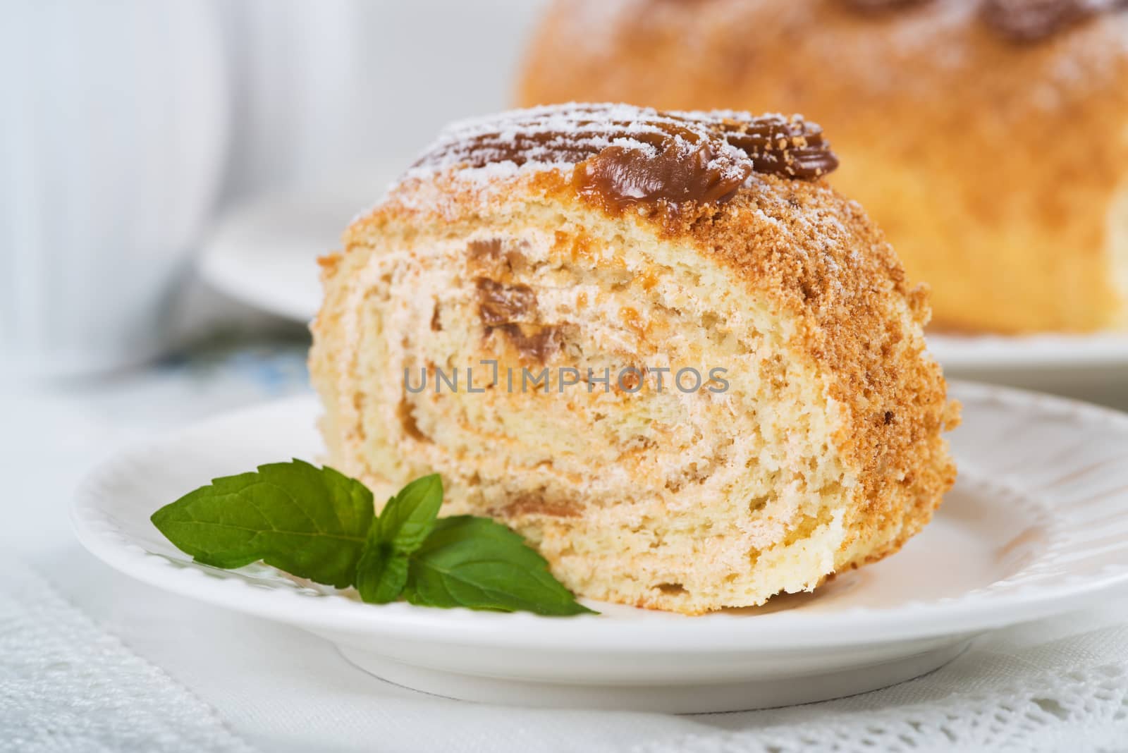 Biscuit roll with condensed milk, selective focus by kzen