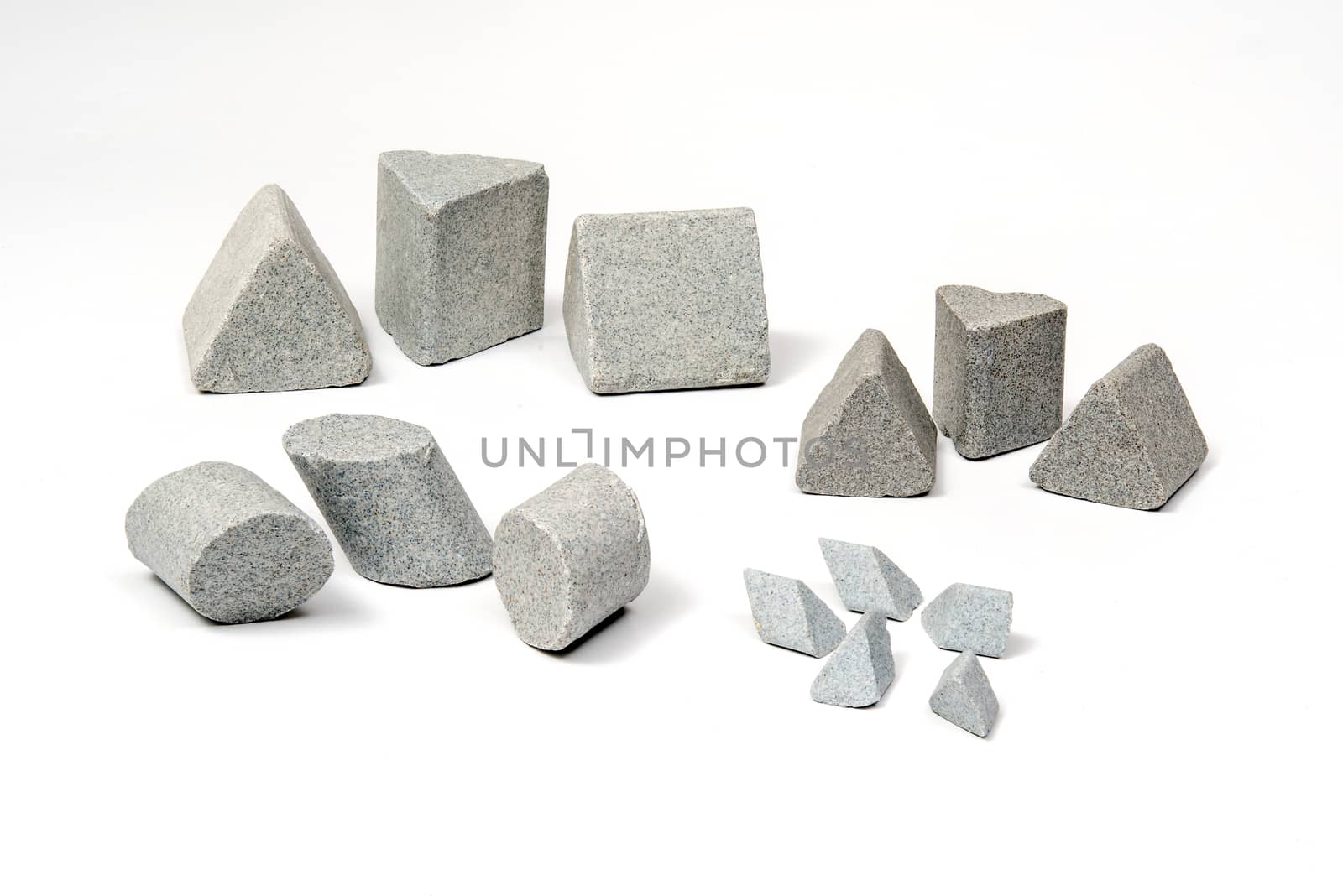 Industrial  sharpening stones sets in different shapes on white background