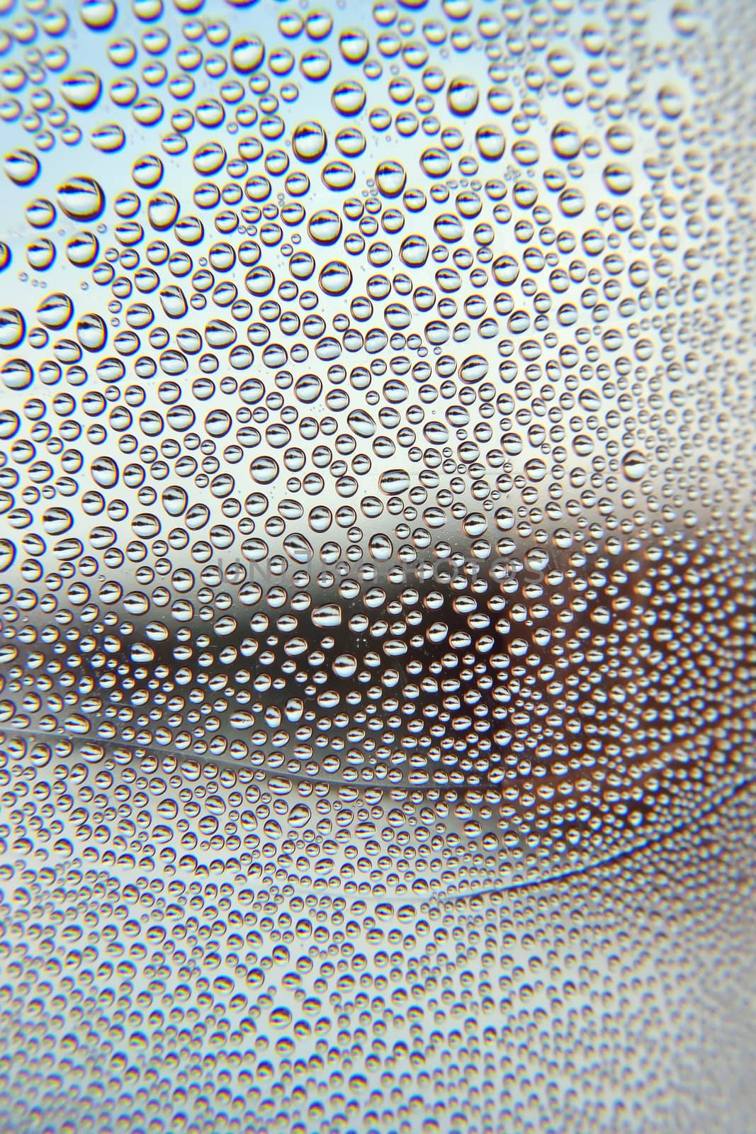 Drops of water on the crooked glass, shallow dof 