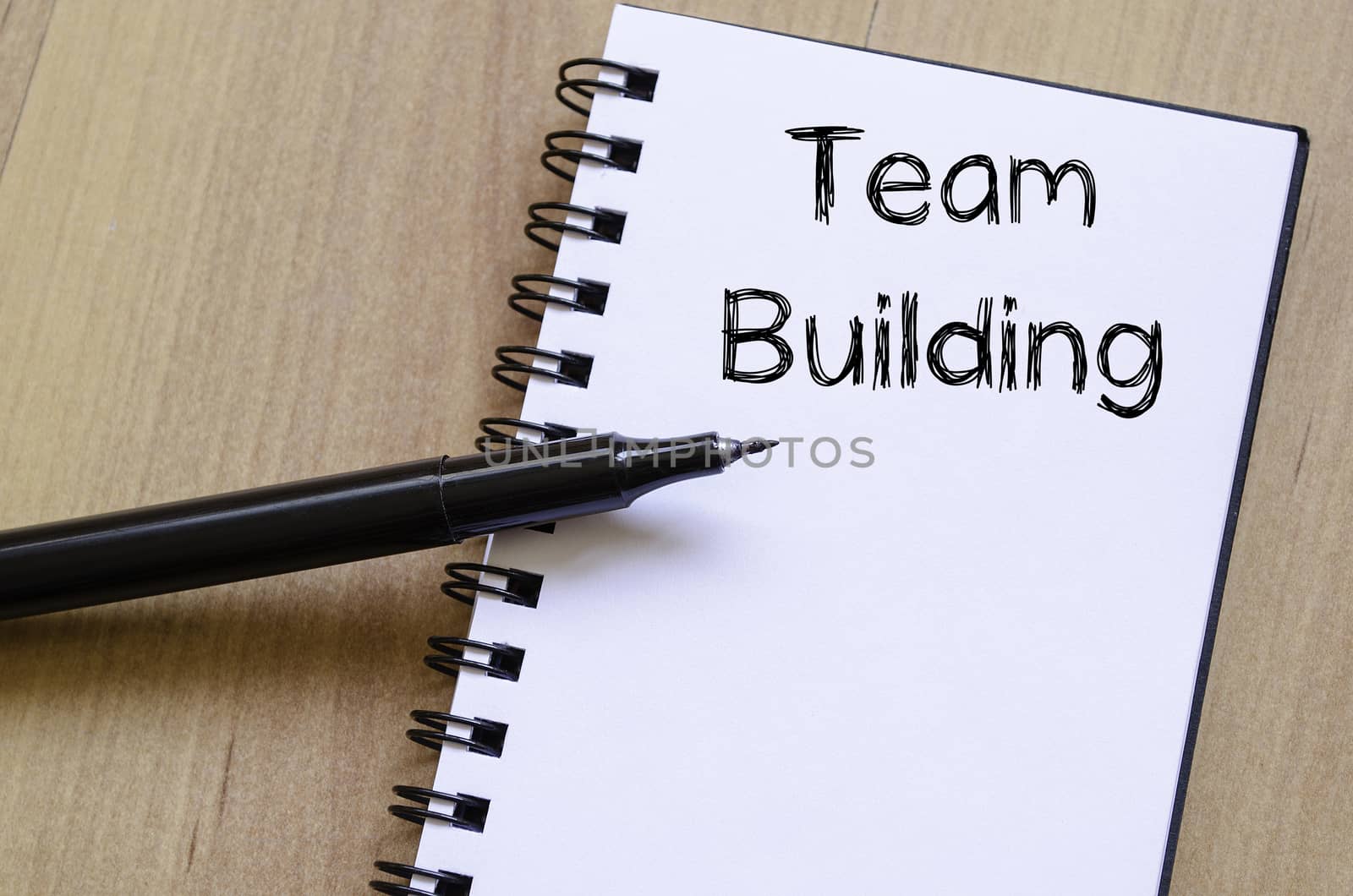 Team building text concept write on notebook with pen