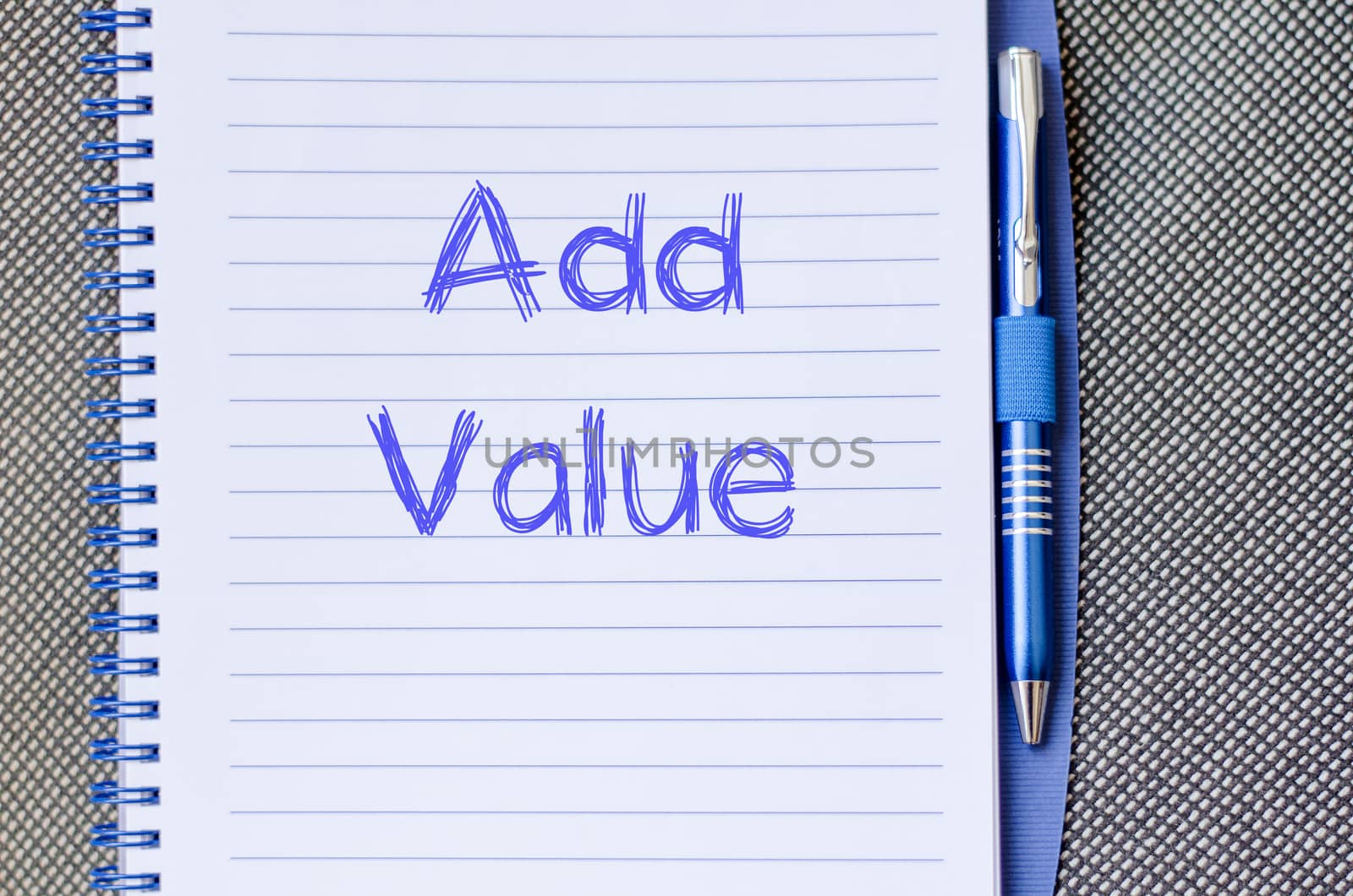 Add valuer text concept write on notebook with pen