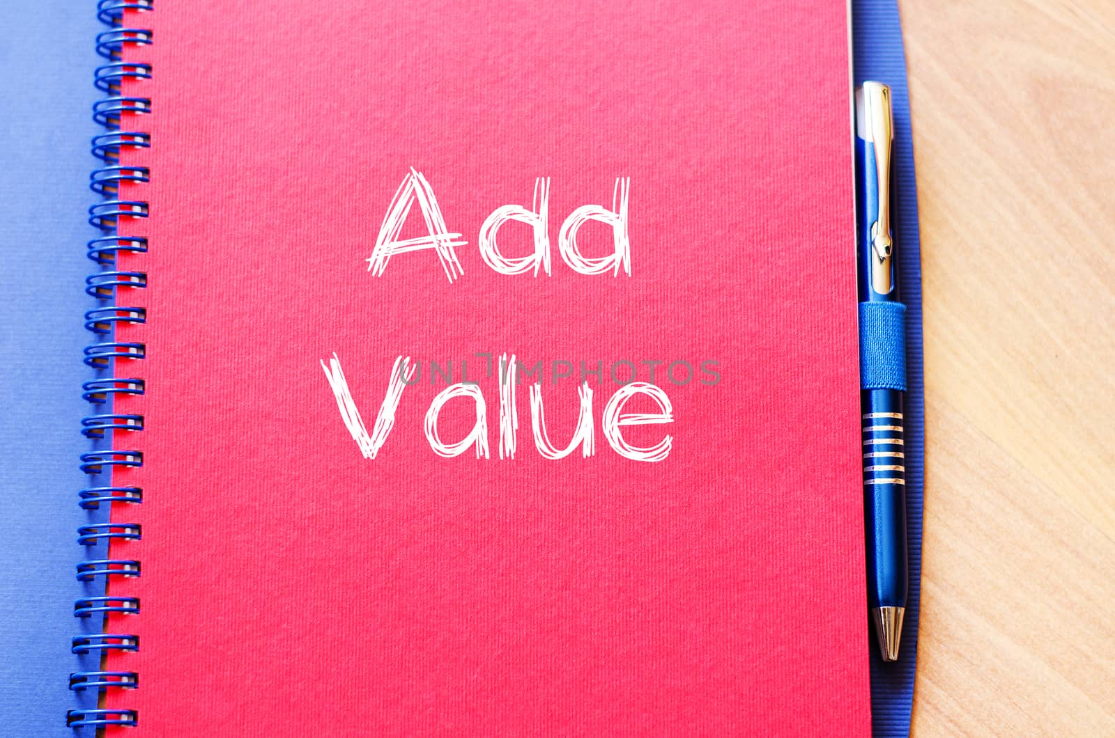 Add valuer text concept write on notebook with pen