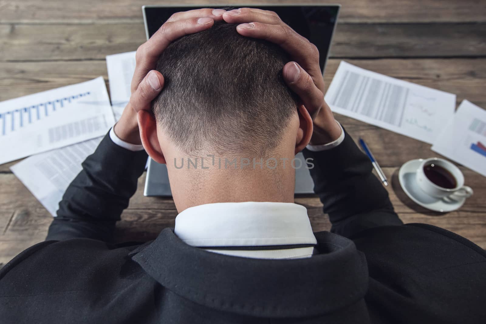 Businessman feel headache by ALotOfPeople