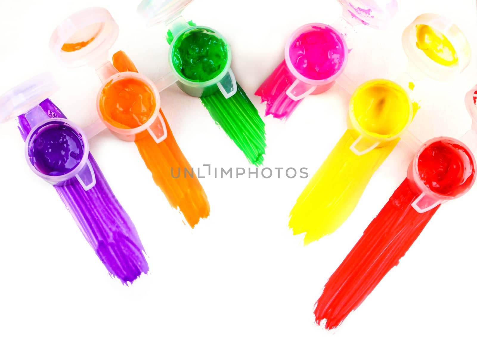set of colorful paints close-up on white background