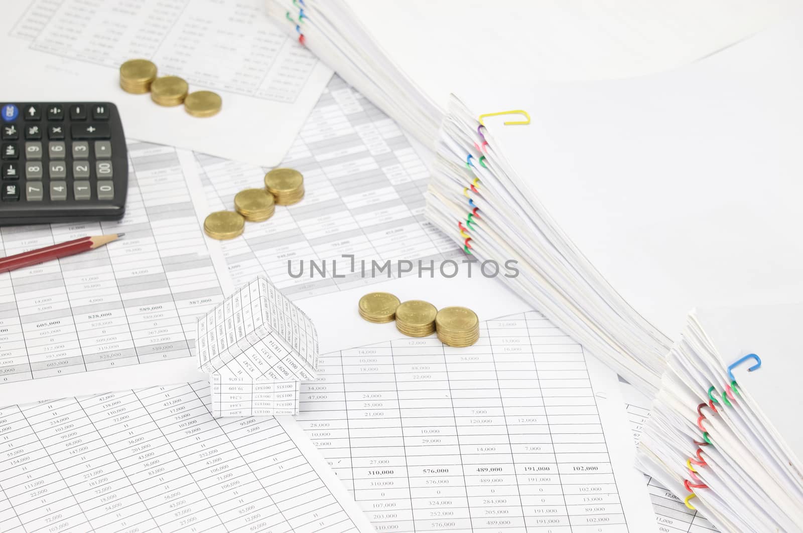 House have blur step gold coins and pencil with calculator by eaglesky