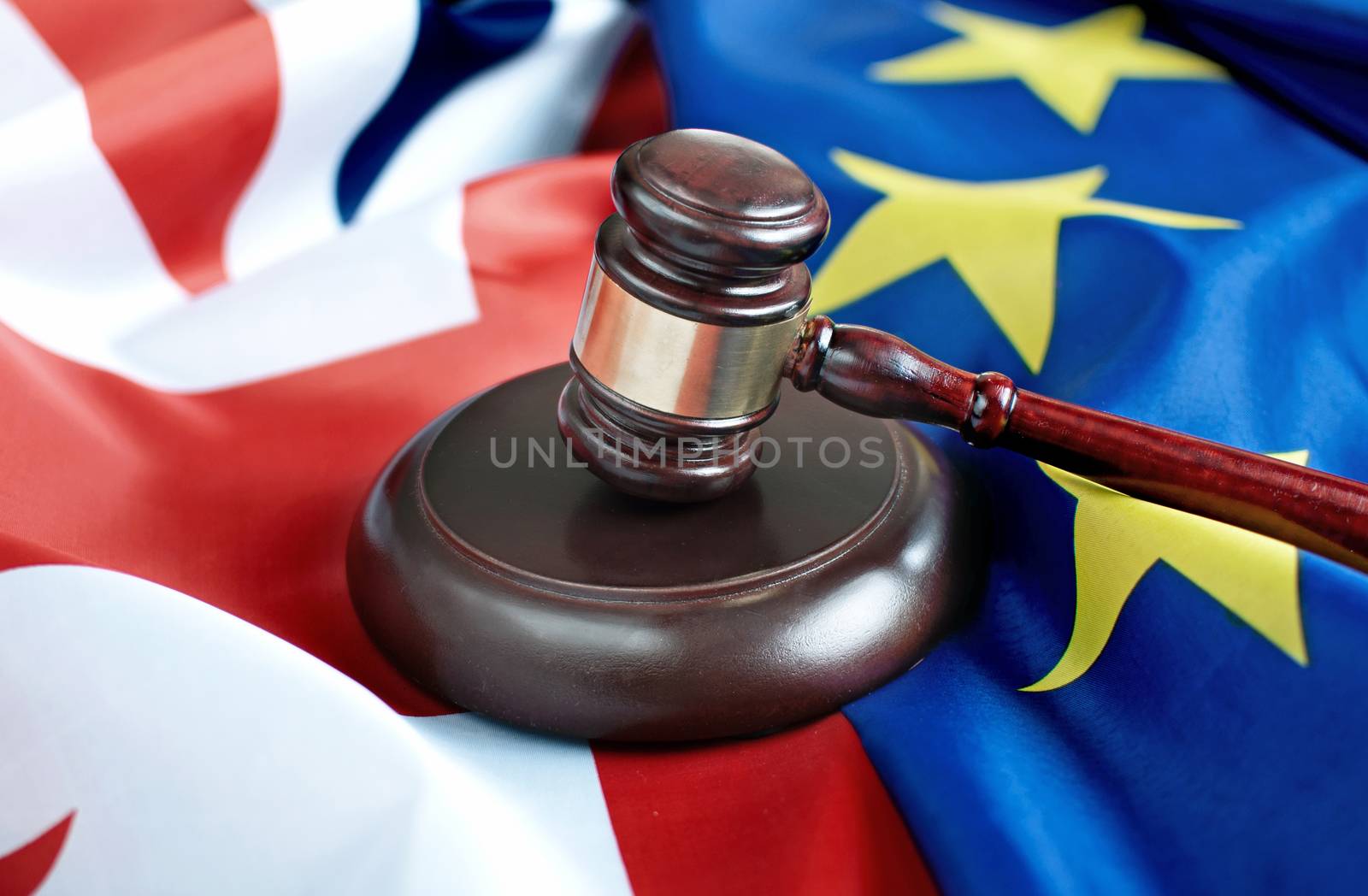 Gavel on top of British and European flags