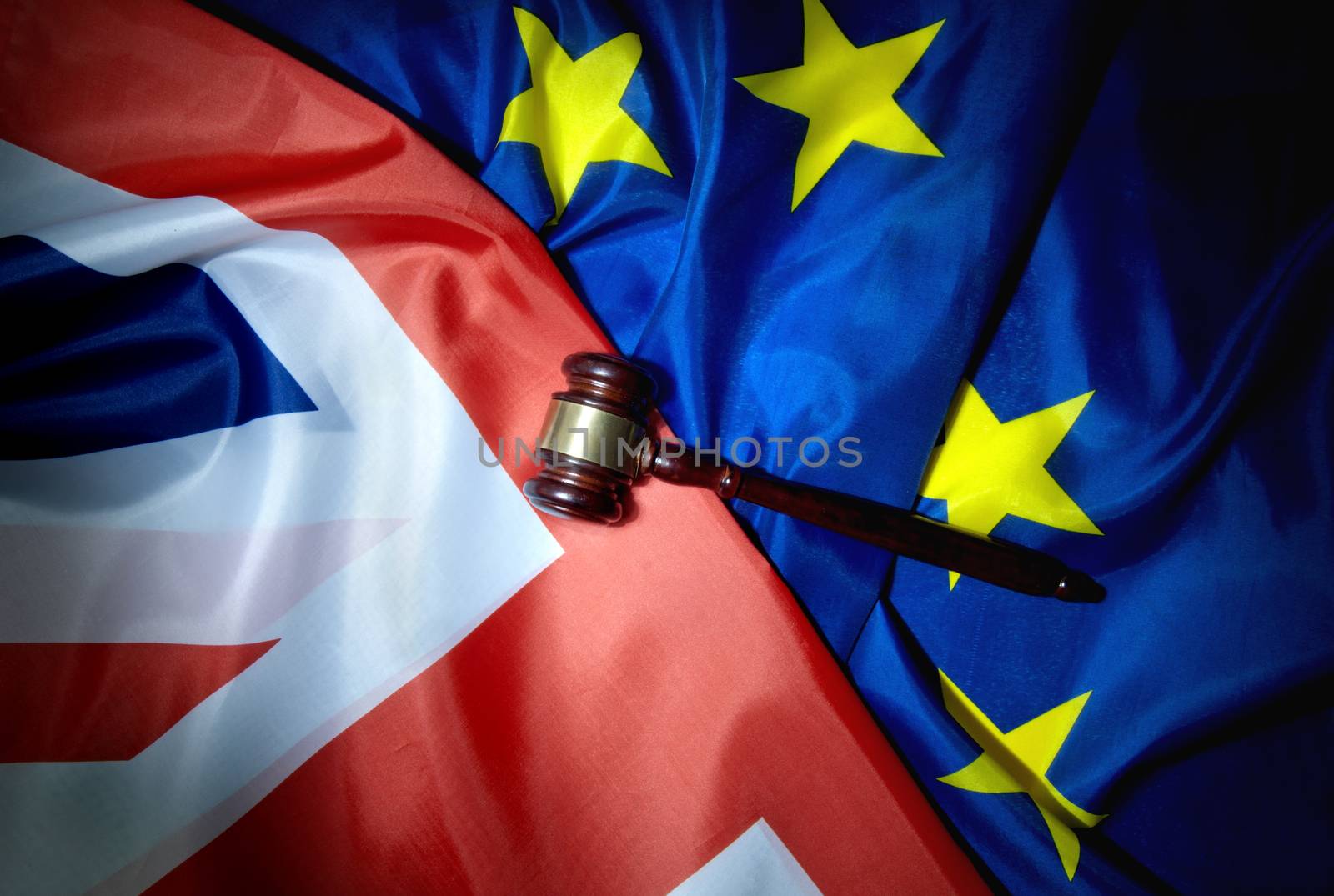 Gavel on top of British and European flags