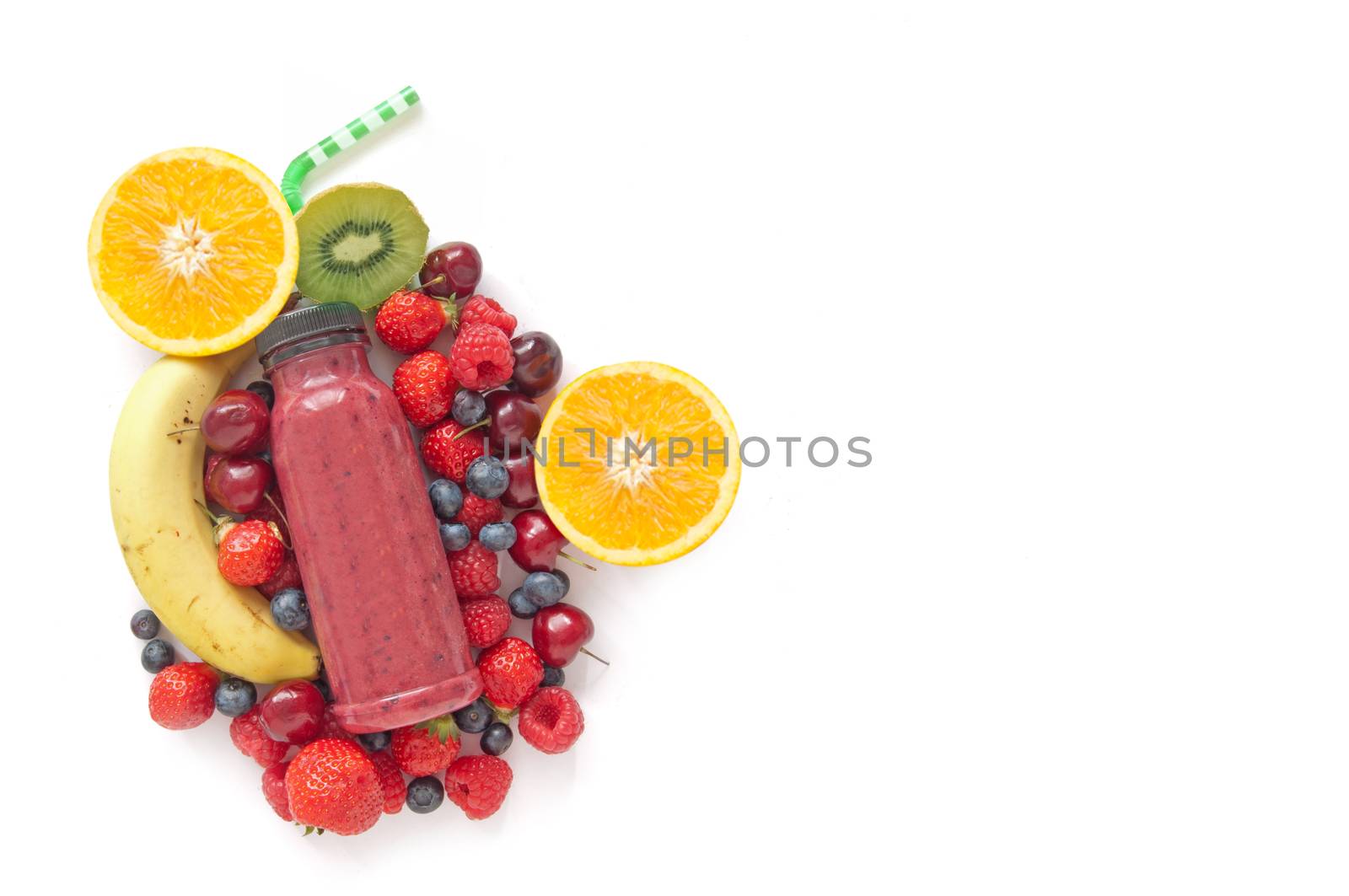 Berry smoothie with raspberries and blueberries over a white background with space for text 