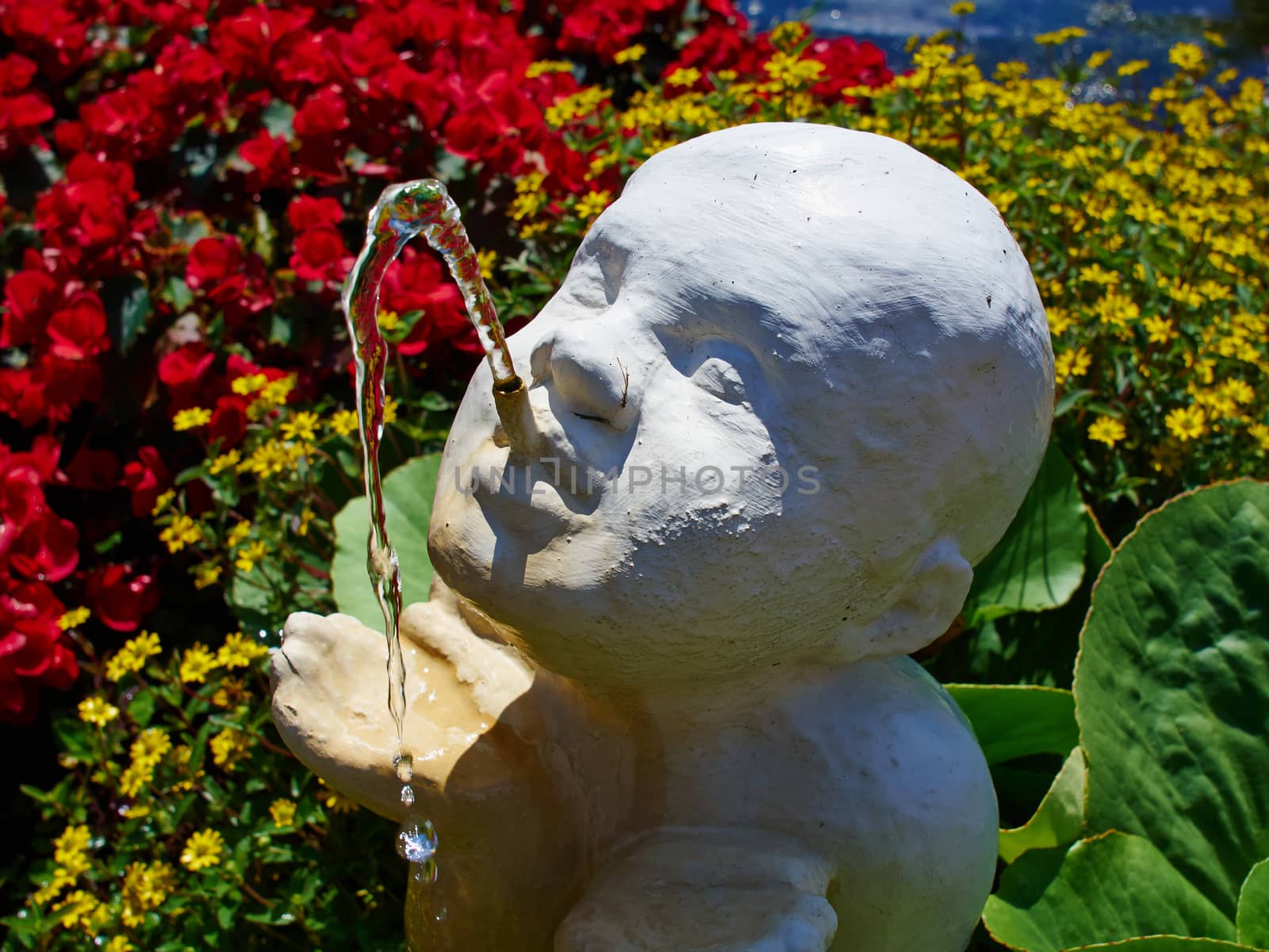 Beautiful garden water fountain figurine of a boy made of white stone
