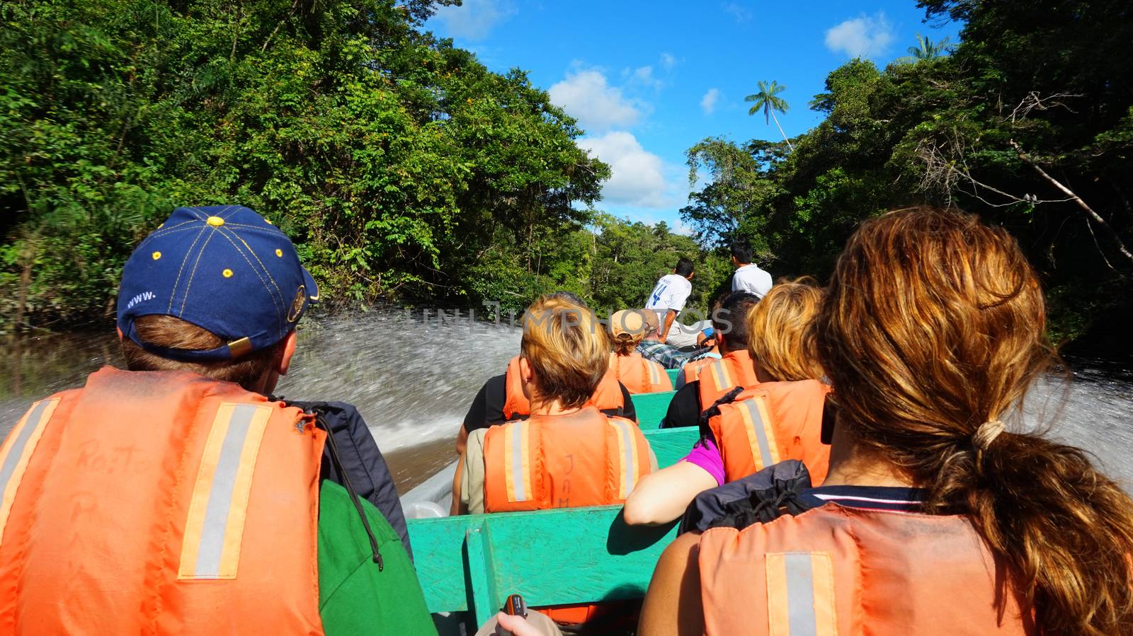 Cuyabeno, Sucumbios / Ecuador - November 20 2014: Tourists traveling by boat on a river in the Ecuadorian Amazon
