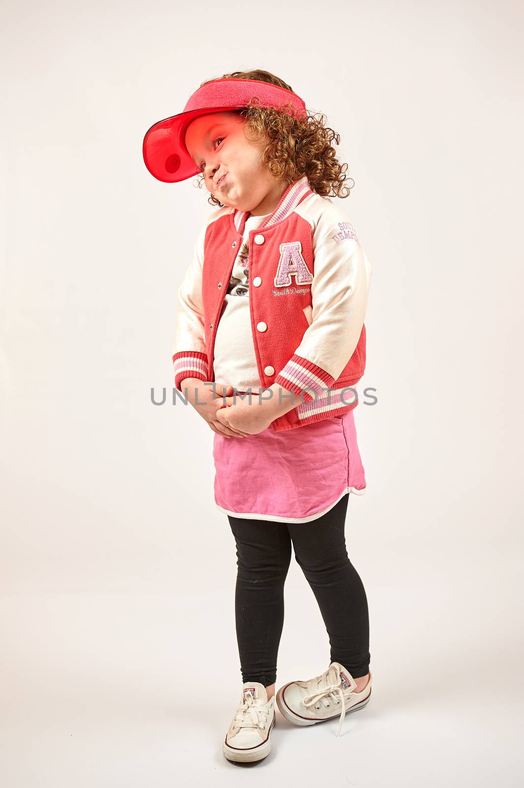 Little Girl Fashion Model With Red Cap by Multipedia