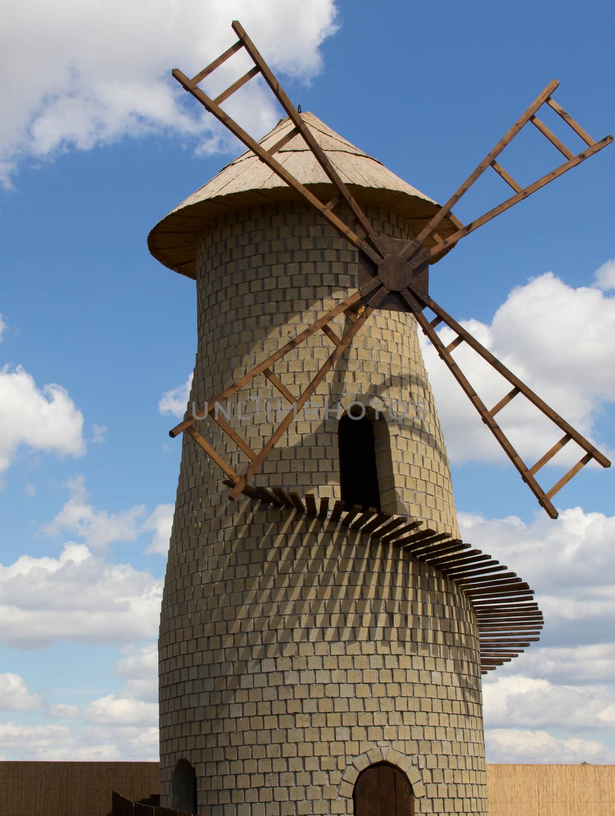 one old mill the sky with clouds. photo