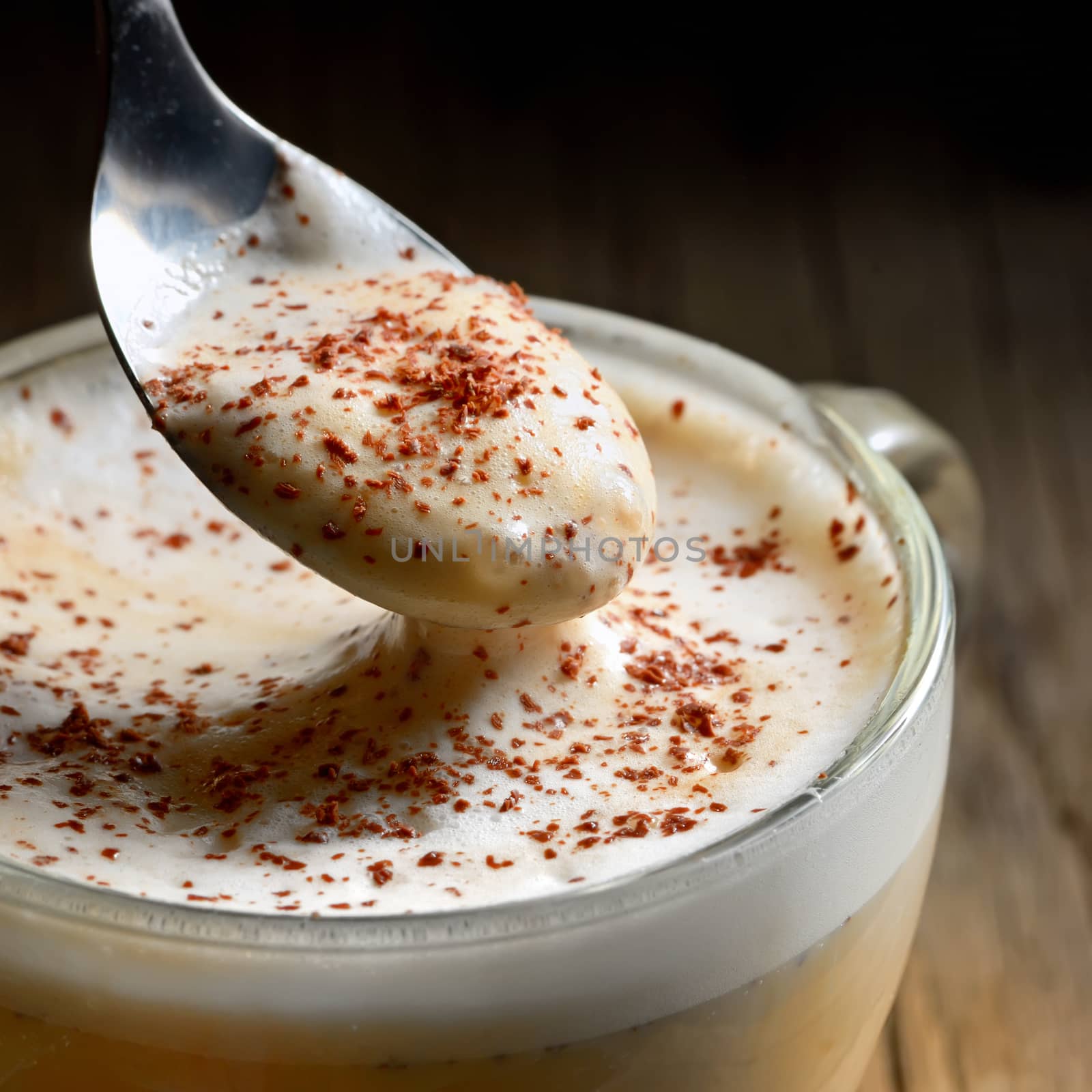 Cup of cofee with foam and chocolate