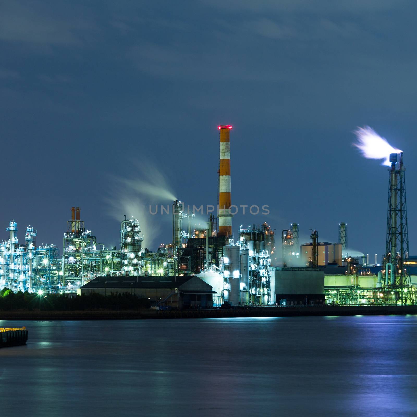 Chimney of a Power plant against blue sky by leungchopan