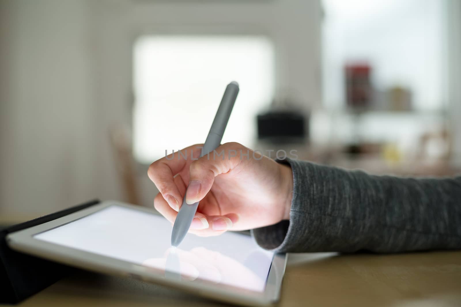 Woman using tablet to design by leungchopan