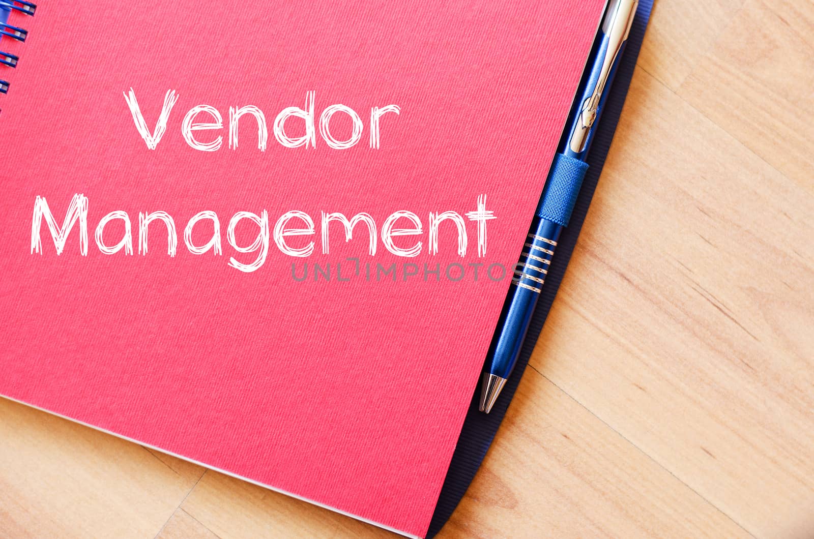 Vendor management text concept write on notebook with pen