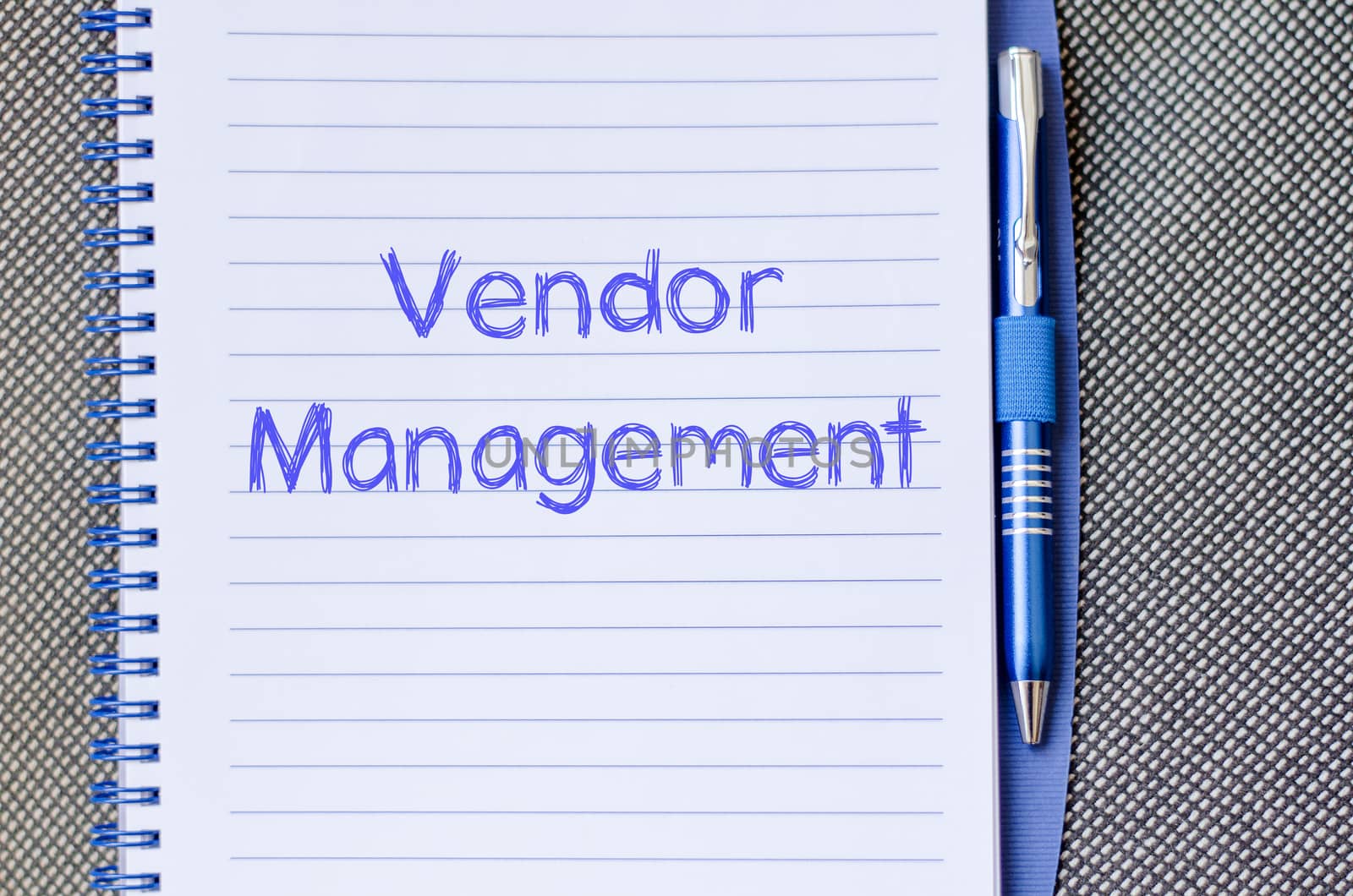 Vendor management text concept write on notebook with pen