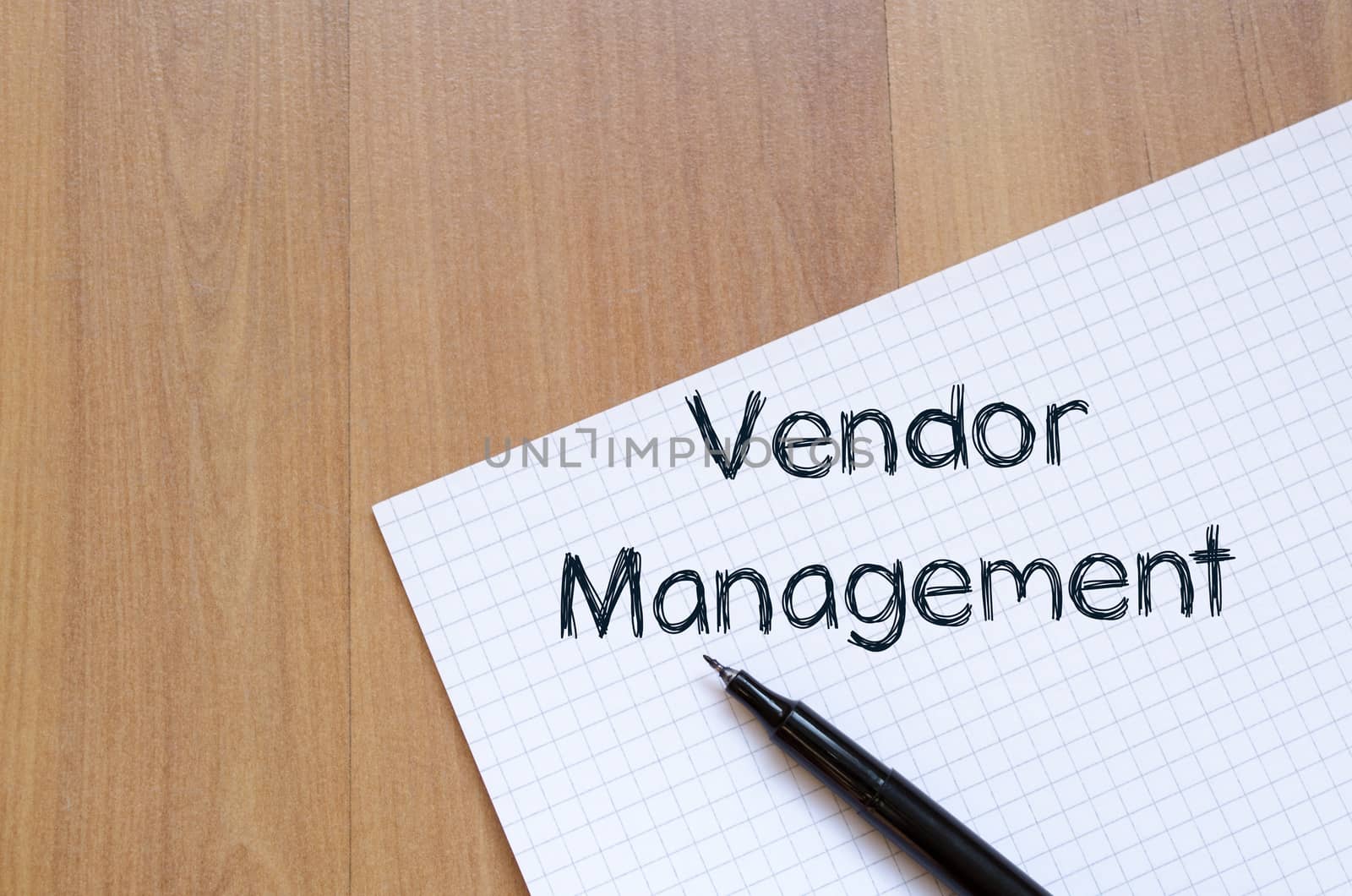 Vendor management text concept write on notebook with pen