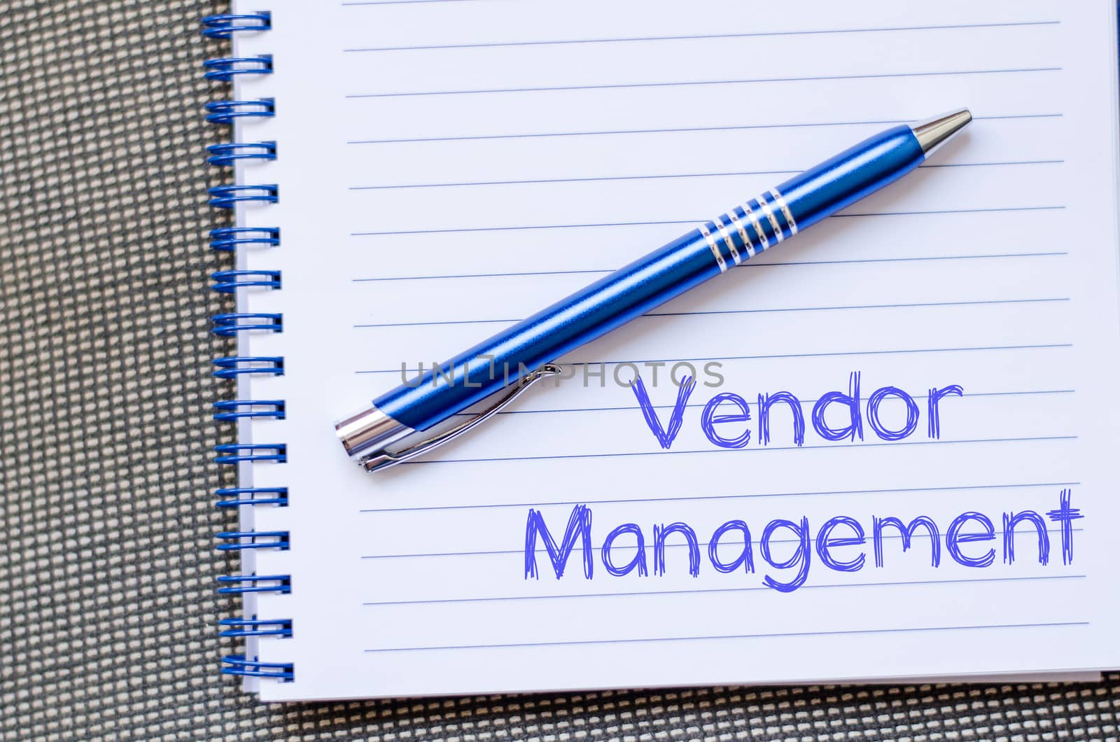Vendor management text concept write on notebook with pen