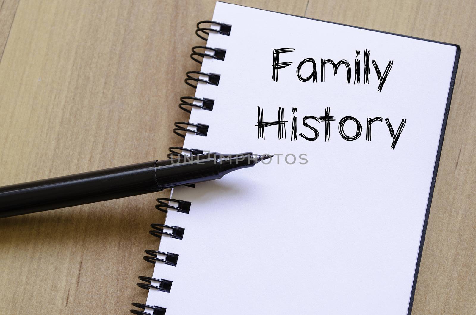 Family history text concept write on notebook with pen