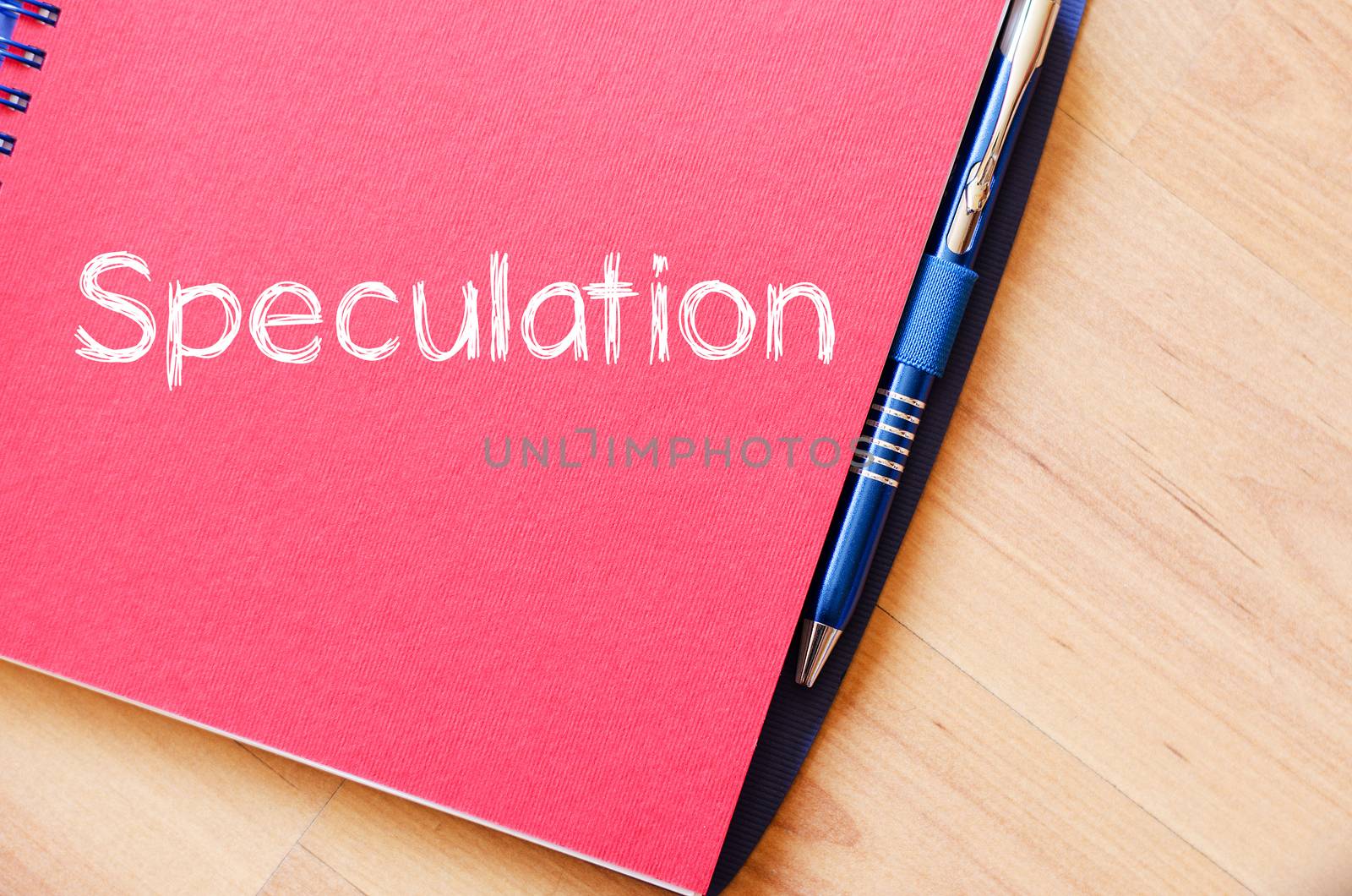Speculation text concept write on notebook with pen