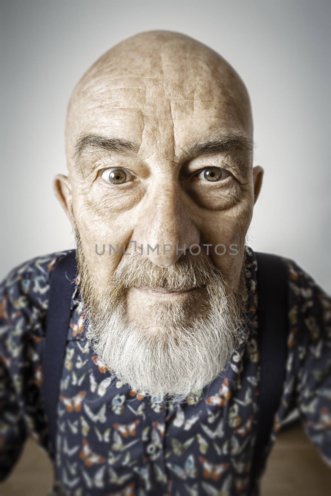 An image of an old man with a beard wide angle portrait