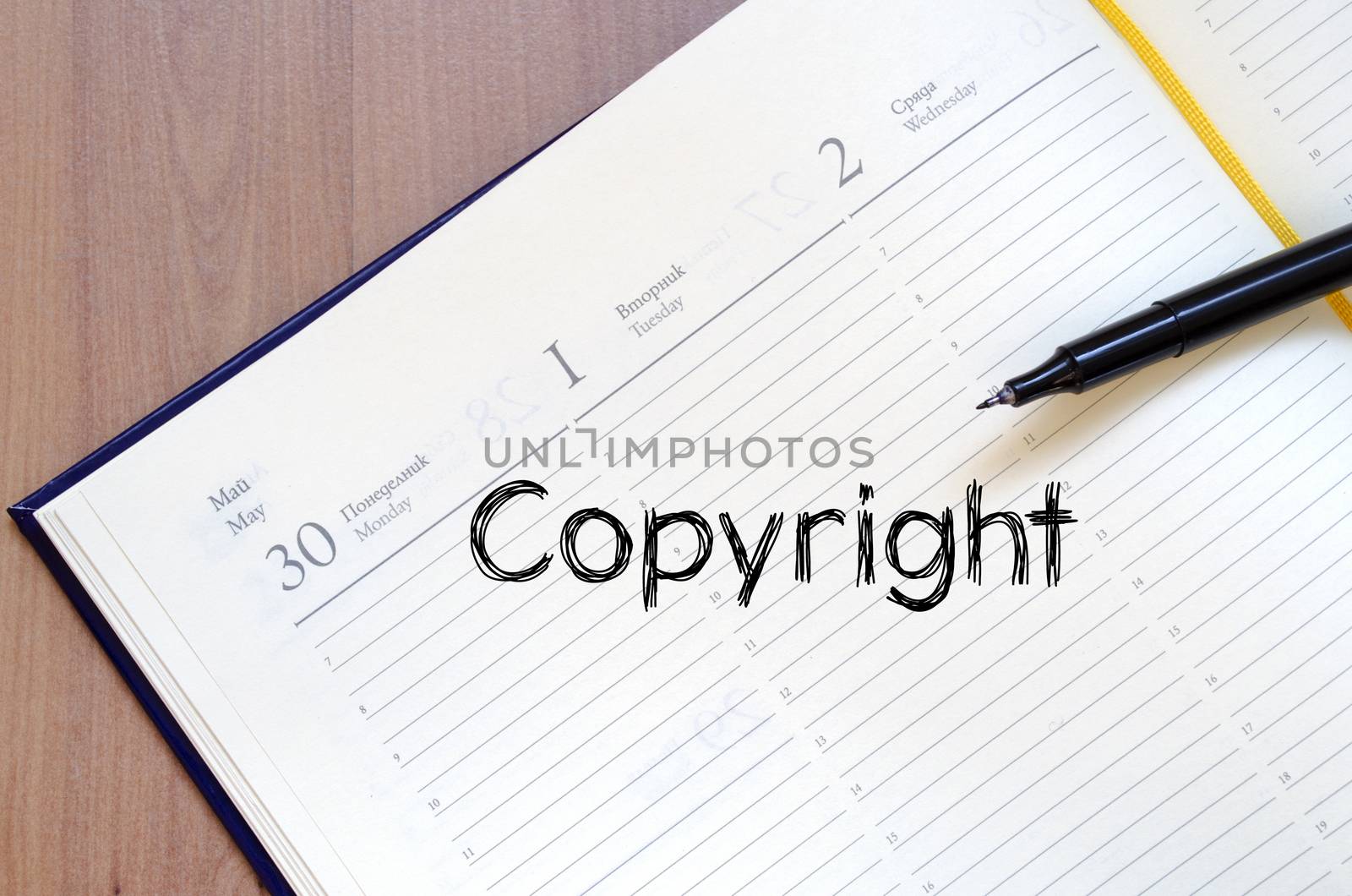 Copyright text concept write on notebook with pen