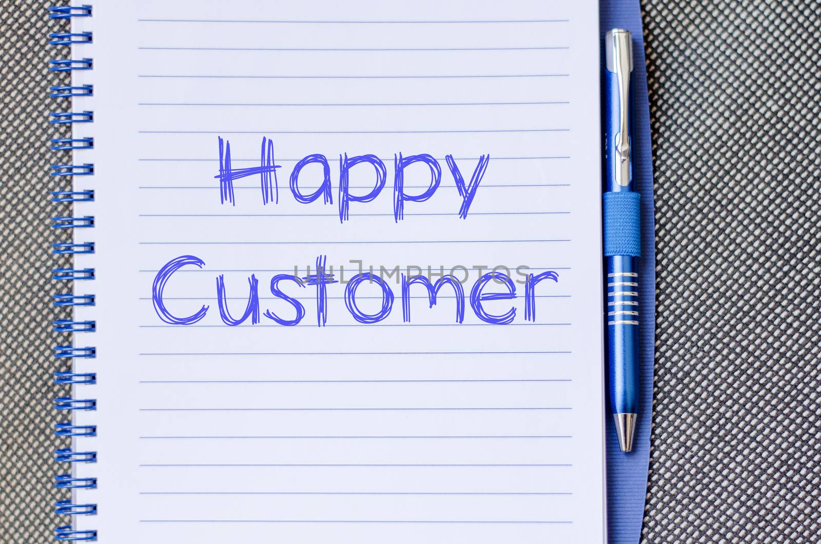 Happy customer text concept write on notebook with pen