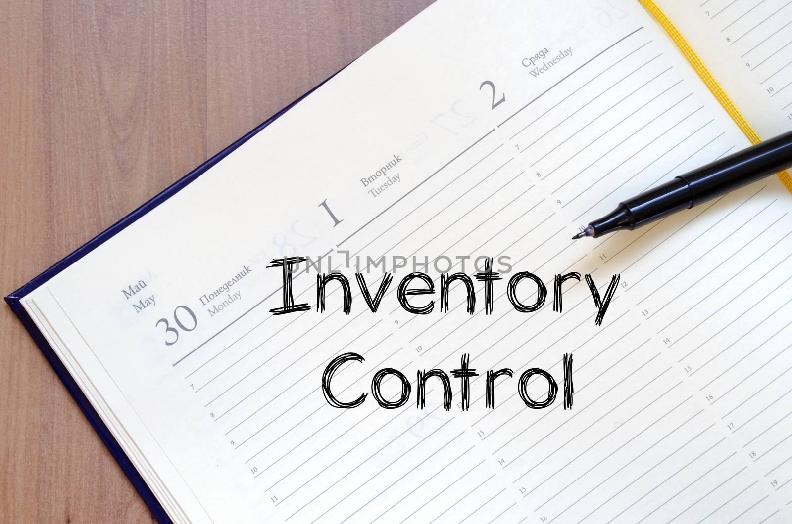 Inventory control text concept write on notebook with pen